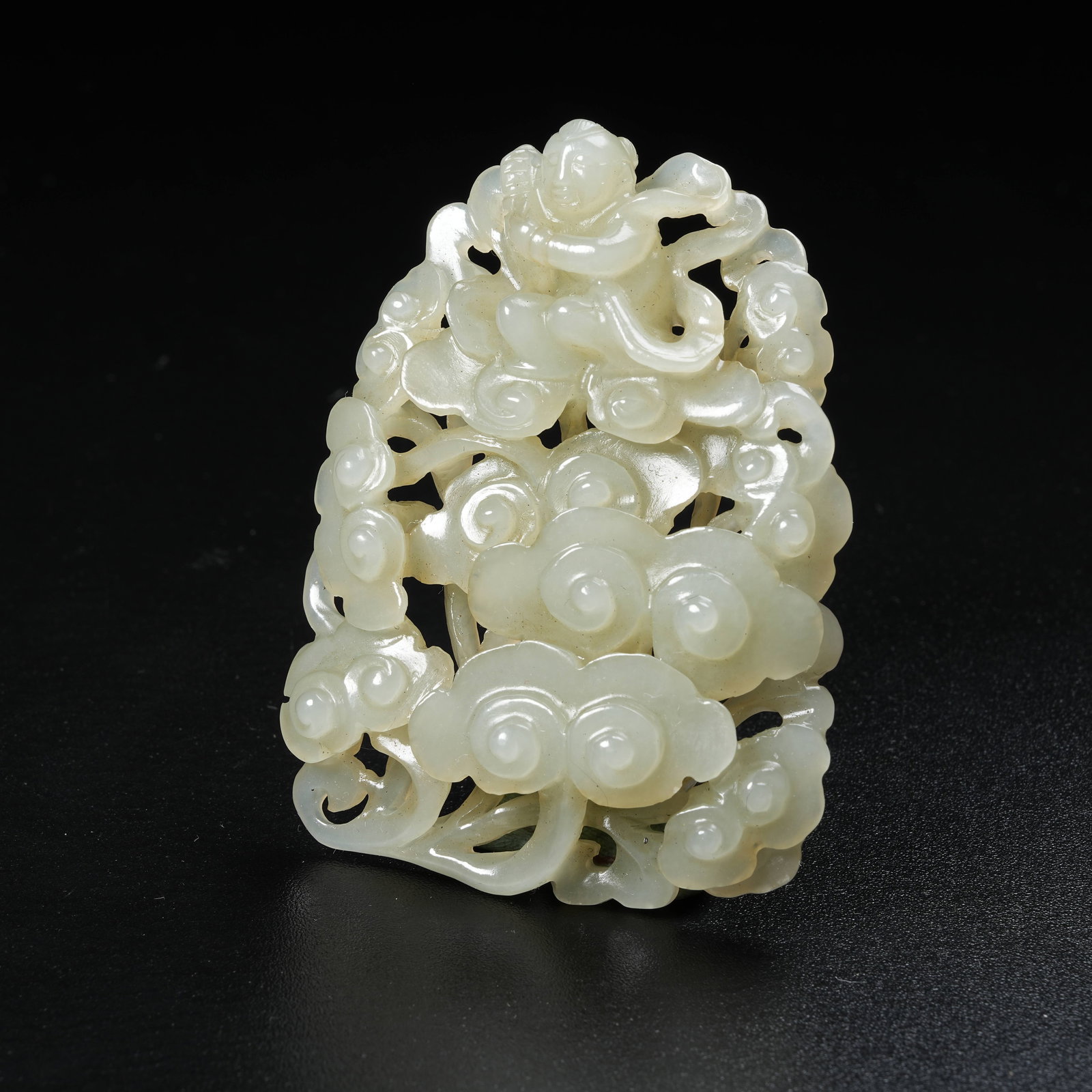 A HETIAN JADE PENDANT WITH AUSPICIOUS CLOUD AND BOY PATTERN: Hetian Jade Pendant with Auspicious Cloud and Boy Pattern