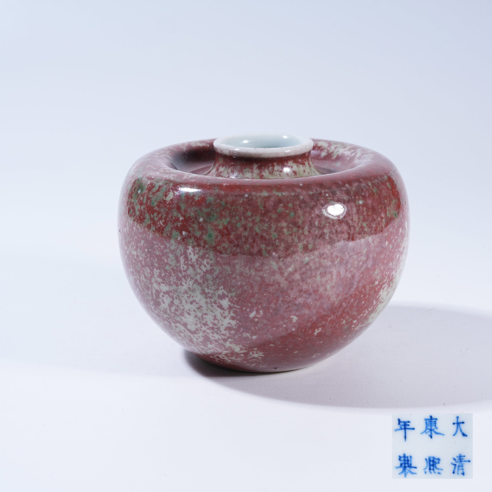 A PEA-RED GLAZED APPLE-SHAPED ZUN VASE: Pea-Red Glazed Apple-Shaped Zun Vase