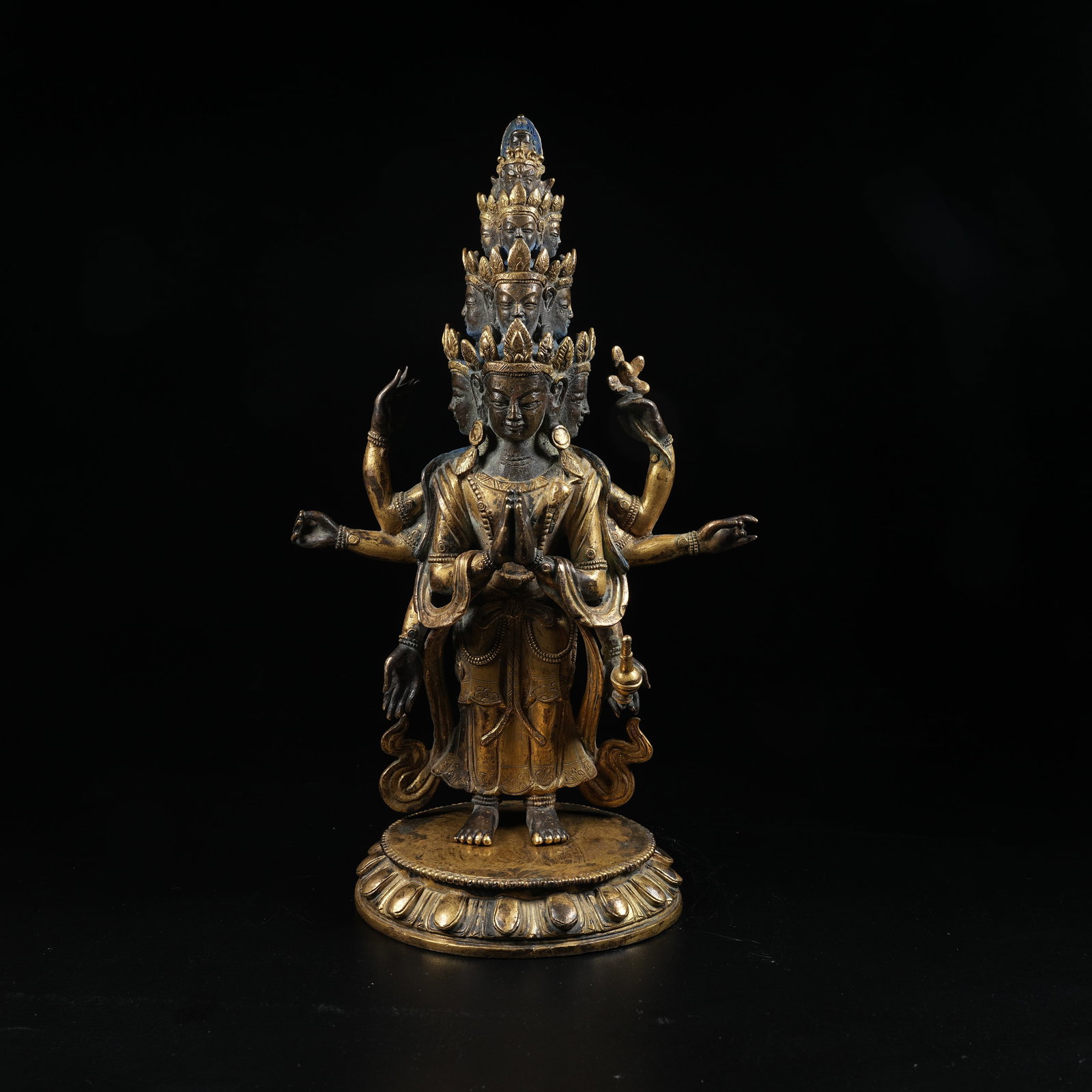 A GILT BRONZE STATUE OF ELEVEN-FACED AVALOKITESHVARA: Gilt Bronze Statue of Eleven-Faced Avalokiteshvara
