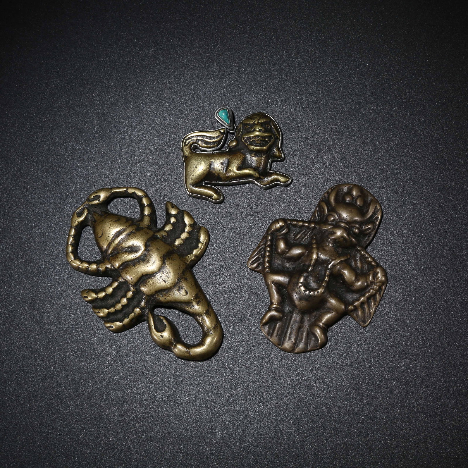 A SET OF BRONZE ARMORED HAND GUARDS (1 of 7)