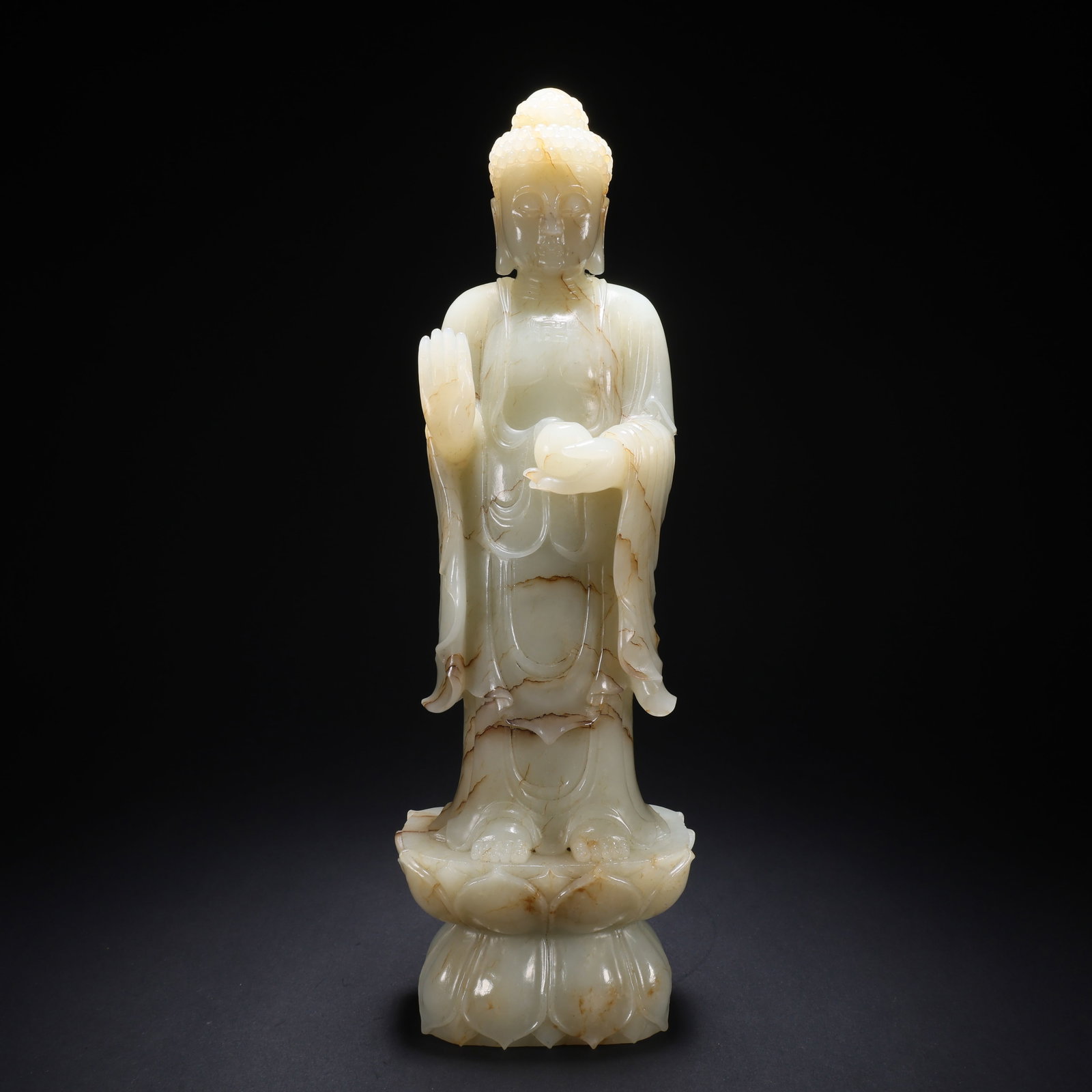 A HETIAN JADE LOTUS-SEAT BEAD-HOLDING STANDING BUDDHA: Hetian Jade Lotus-Seat Bead-Holding Standing Buddha
