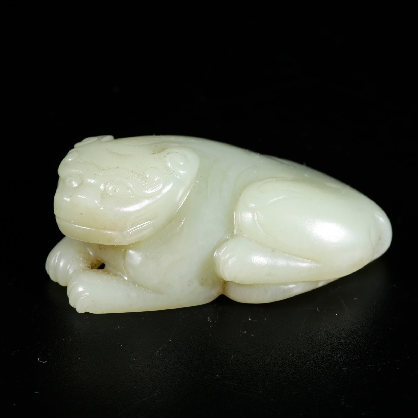 A HETIAN JADE CARVED TIGER-SHAPED ORNAMENT: Hetian Jade Carved Tiger-shaped Ornament