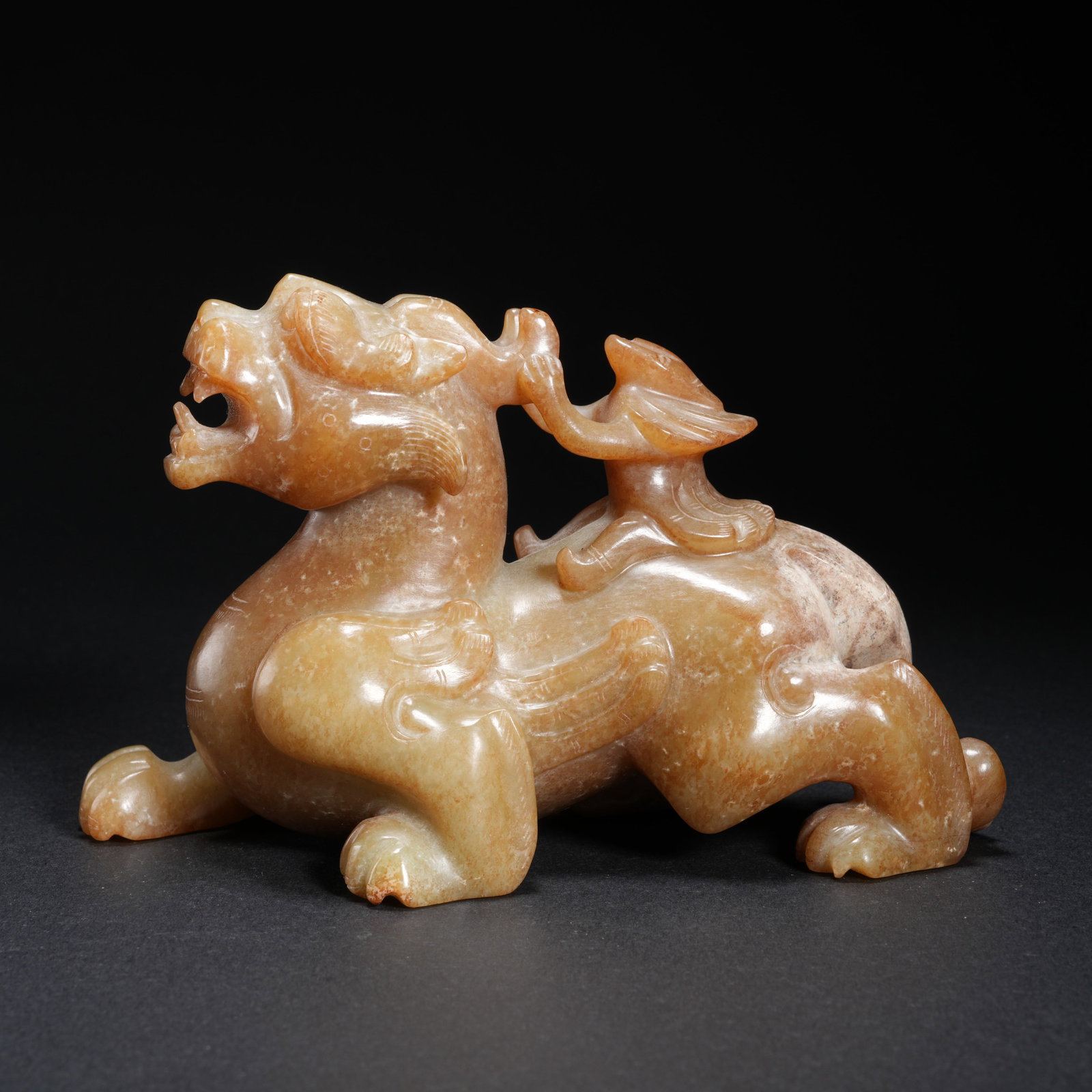A HETIAN JADE BEAST-SHAPED ORNAMENT: Hetian Jade Beast-Shaped Ornament