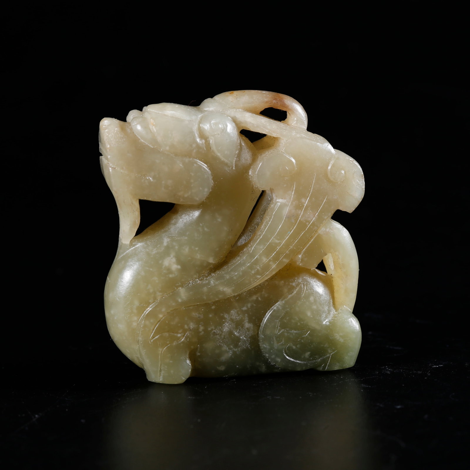 A HETIAN JADE CARVED BEAST-SHAPED ORNAMENT: Hetian Jade Carved Beast-shaped Ornament