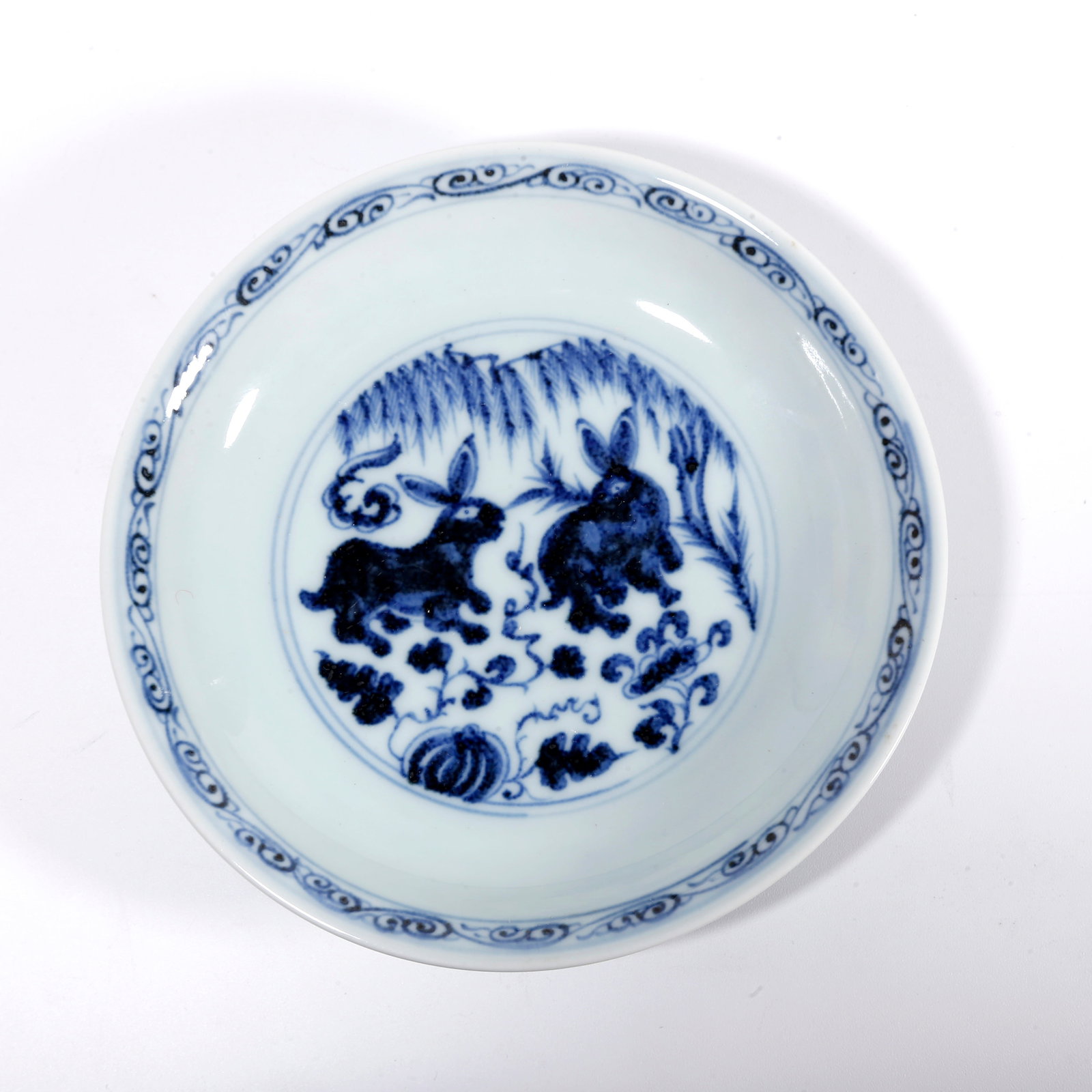 A BLUE AND WHITE WASHER WITH RABBIT PATTERN: Blue and White Washer with Rabbit Pattern
