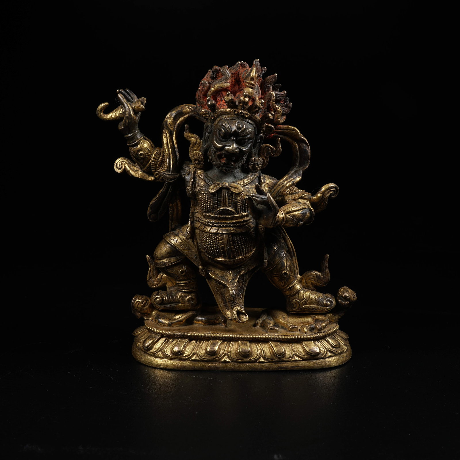A GILT BRONZE STATUE OF RED LORD OF DESTINY: Gilt Bronze Statue of Red Lord of Destiny