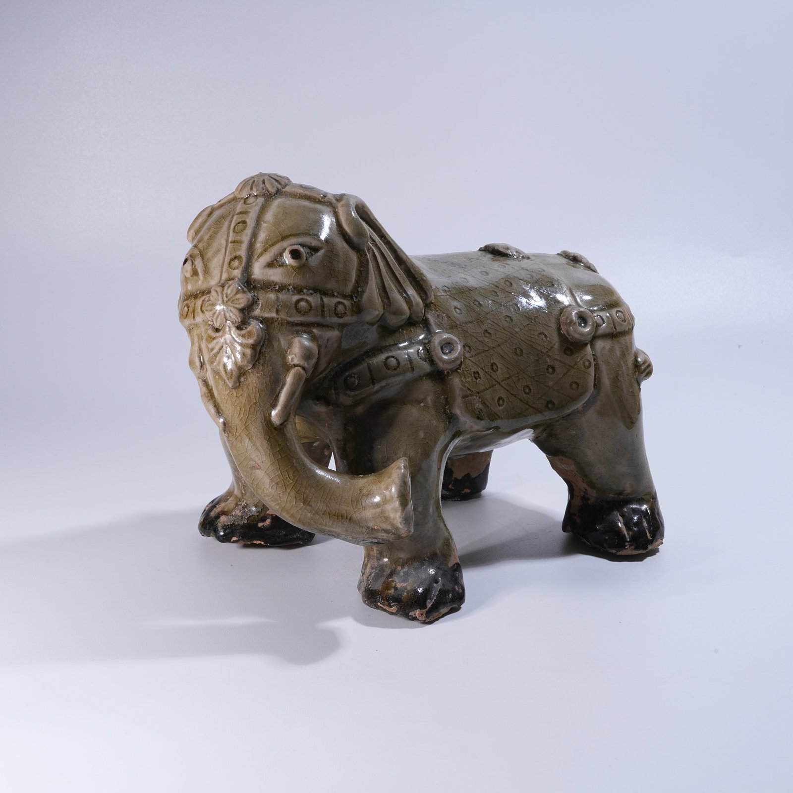 A CELADON "PEACE THROUGH ELEPHANTS" FIGURINE (1 of 8)
