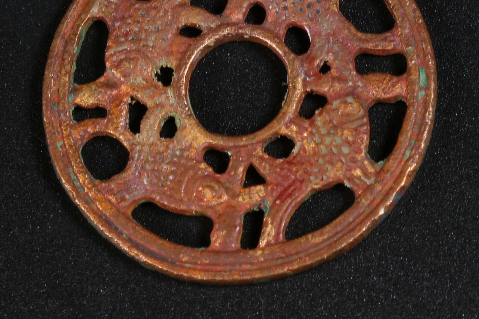 A BRONZE FOUR-FISH RING - 4