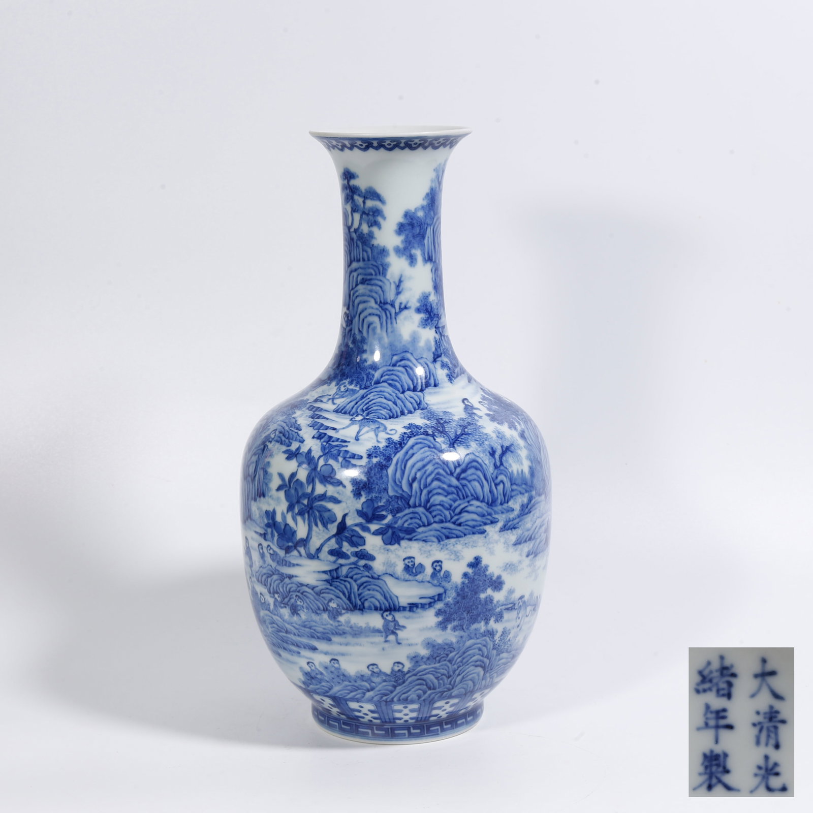 A BLUE-AND-WHITE VASE WITH LANDSCAPE MOTIFS: Blue-and-White Vase with Landscape Motifs