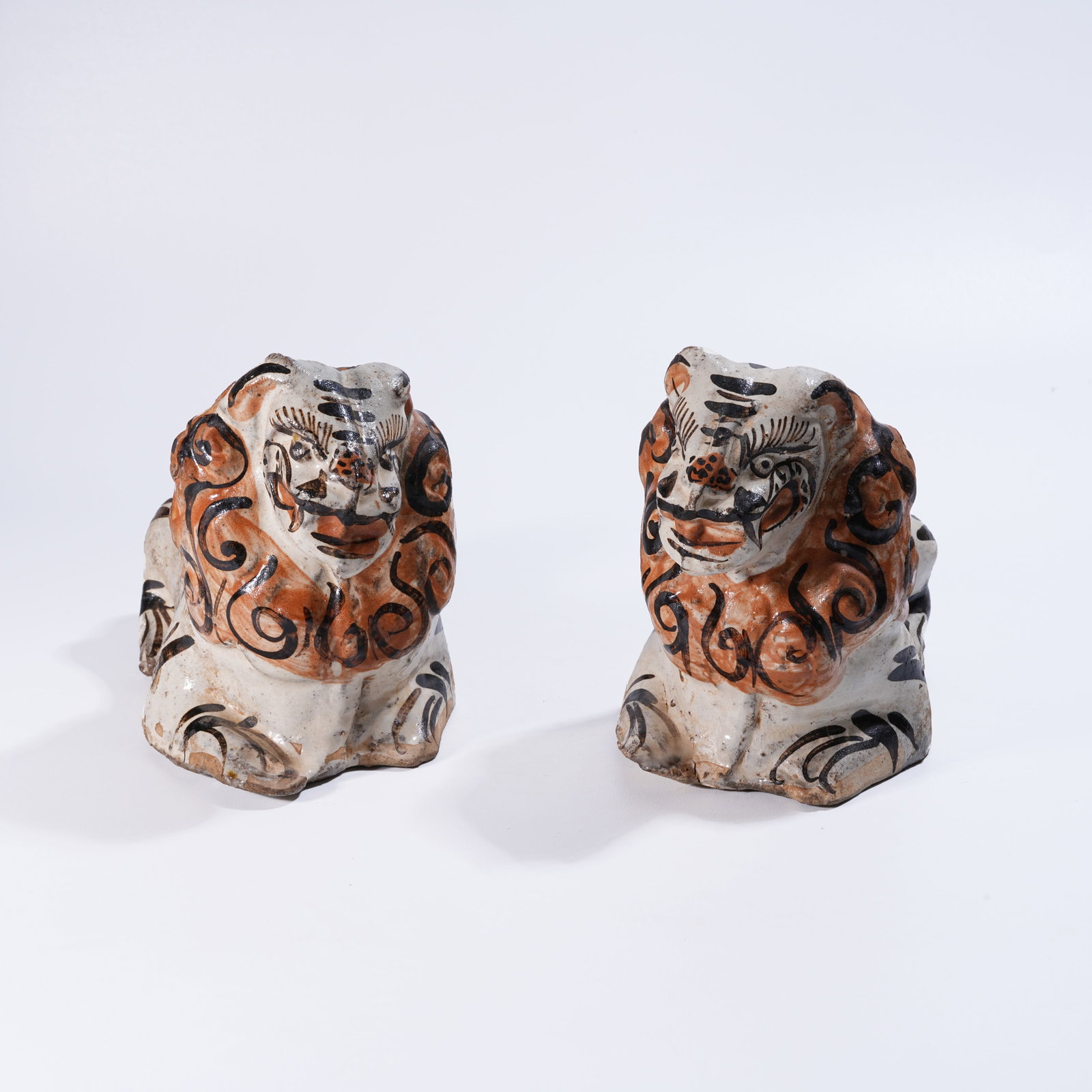 A SET OF WHITE-GLAZED TIGER PILLOW FRAGMENTS: Set of White-Glazed Tiger Pillow Fragments