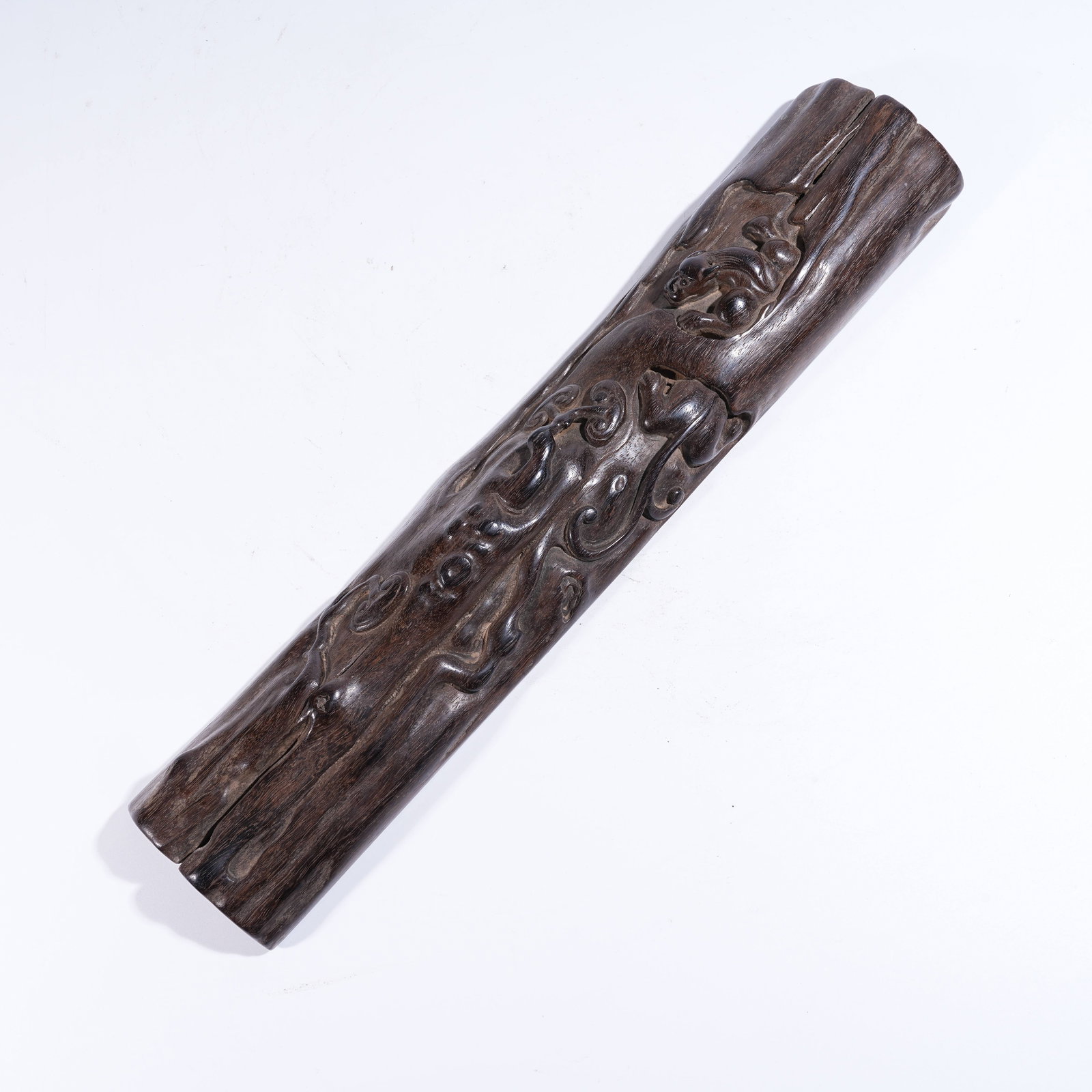 A ZITAN PAPERWEIGHT WITH AUSPICIOUS BEAST MOTIFS: Zitan Paperweight with Auspicious Beast Motifs