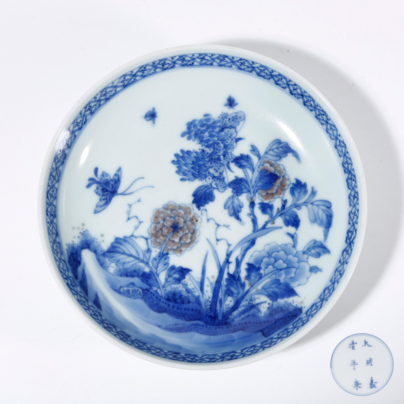A BLUE AND WHITE WASHER WITH FLOWER AND BUTTERFLY PATTERN (1 of 10)