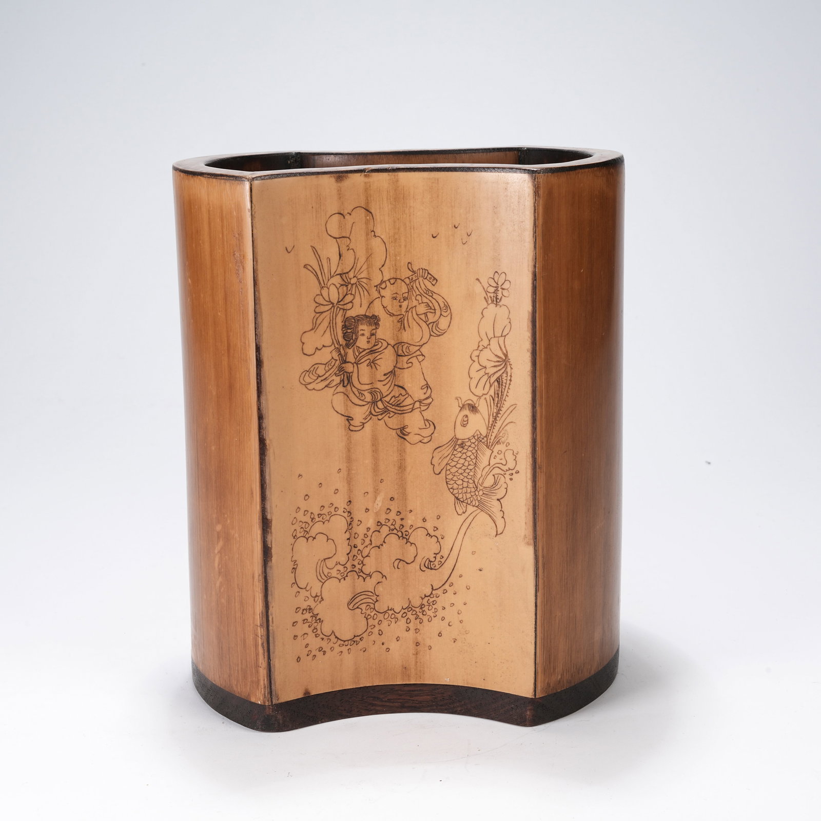 A BAMBOO ROOT CARVED BRUSH POT WITH HARMONIOUS IMMORTALS PATTERN AND CONCAVE CORNER (1 of 9)