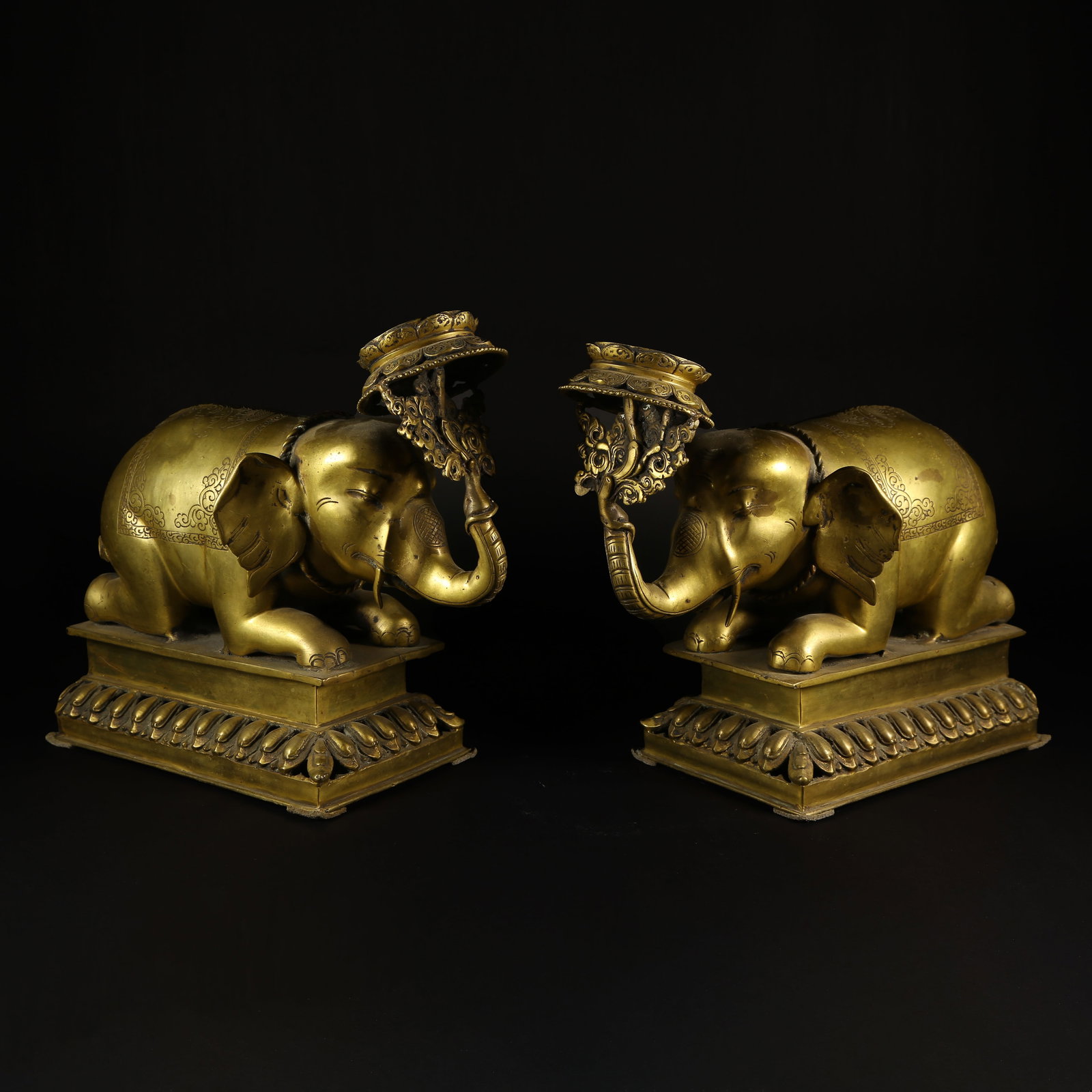 A GILT-BRONZE "PEACE AND PROSPERITY" ELEPHANT CANDLESTICK: Gilt-Bronze "Peace and Prosperity" Elephant Candlestick