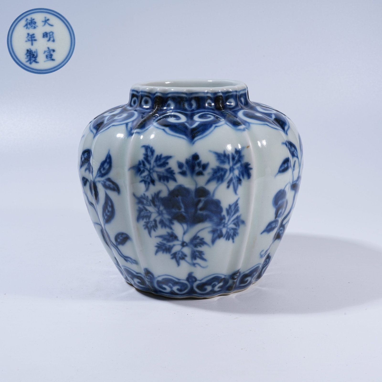A BLUE-AND-WHITE LOBED JAR WITH FLORAL MOTIFS: Blue-and-White Lobed Jar with Floral Motifs
