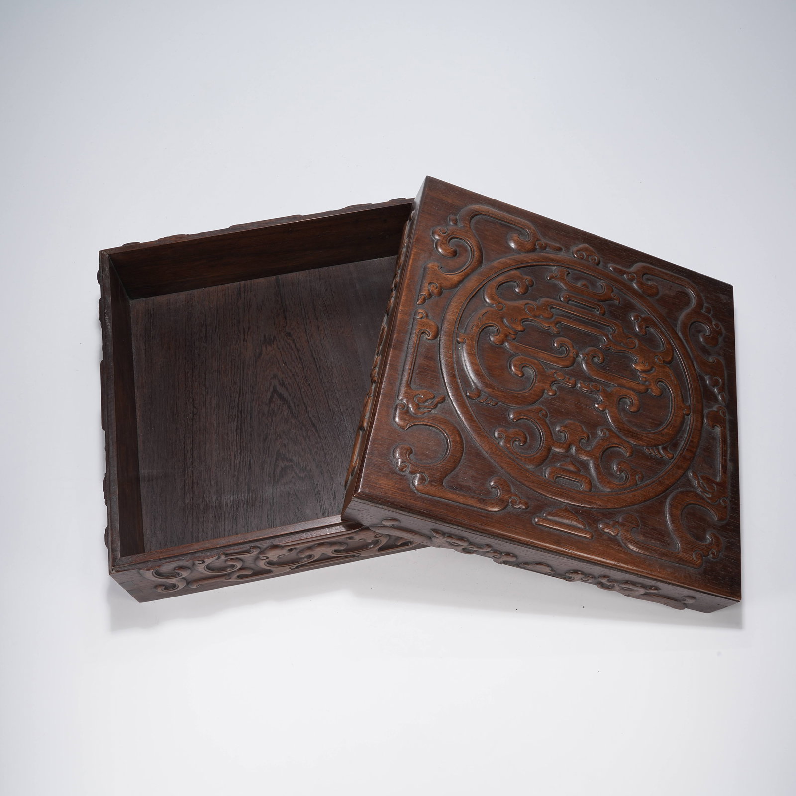 A SQUARE COVERED BOX OF HUANGHUALI WOOD WITH ROUND DRAGON PATTERN (1 of 10)