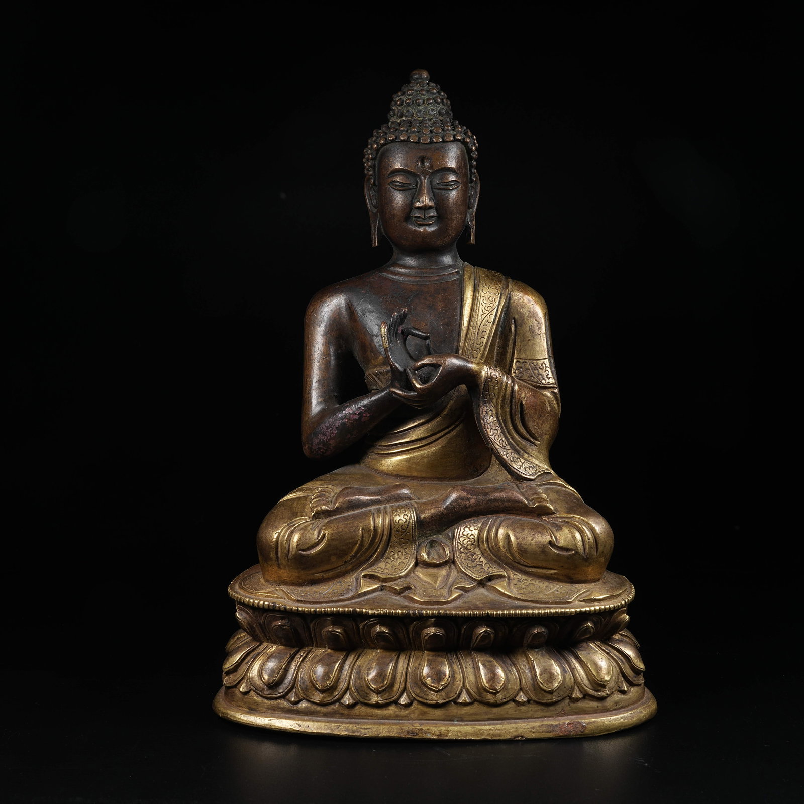 A GILT BRONZE STATUE OF DIPANKARA BUDDHA: Gilt Bronze Statue of Dipankara Buddha