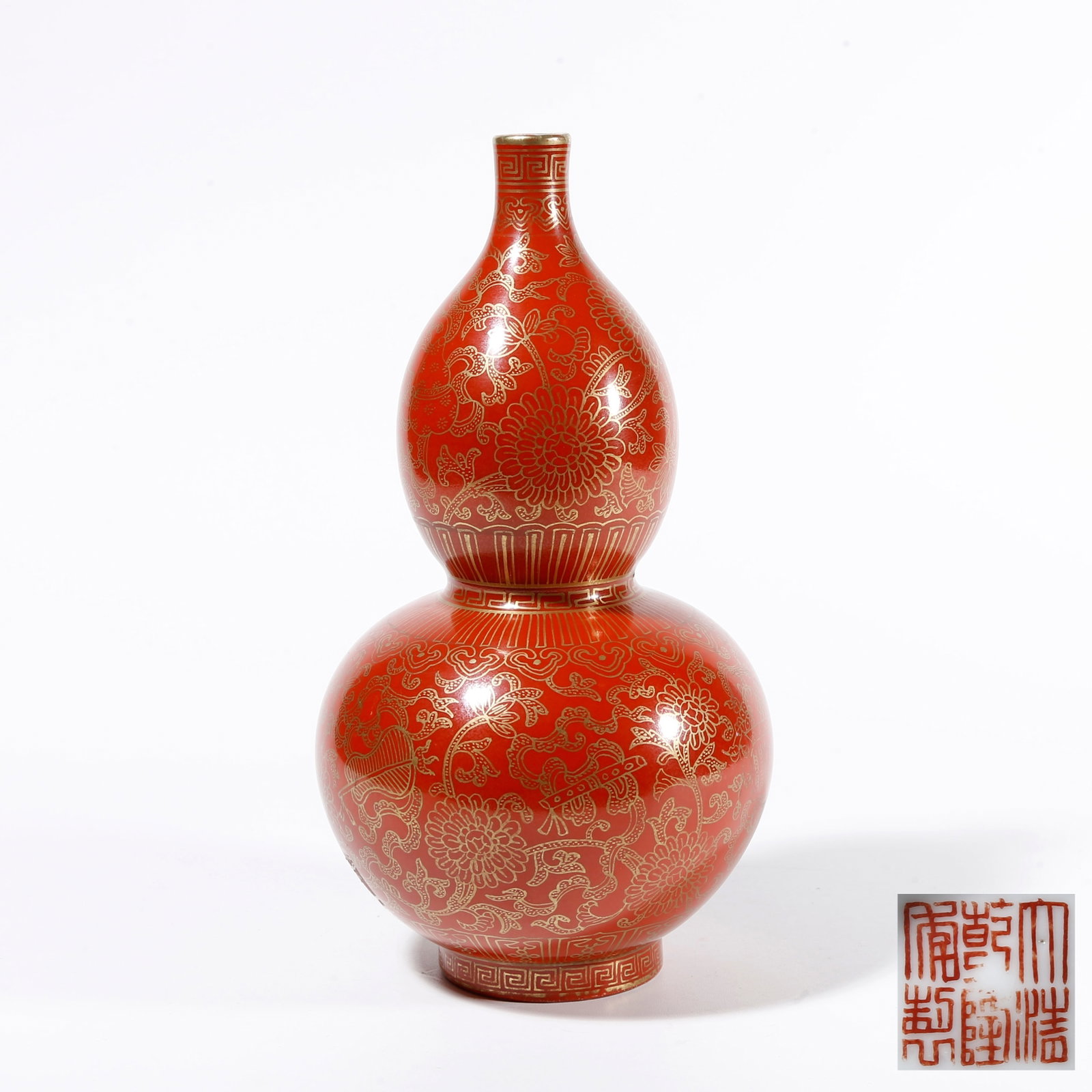 A CARMINE GROUND GILDED GOURD VASE WITH INTERLOCKING FLORAL PATTERN: Carmine Ground Gilded Gourd Vase with Interlocking Floral Pattern