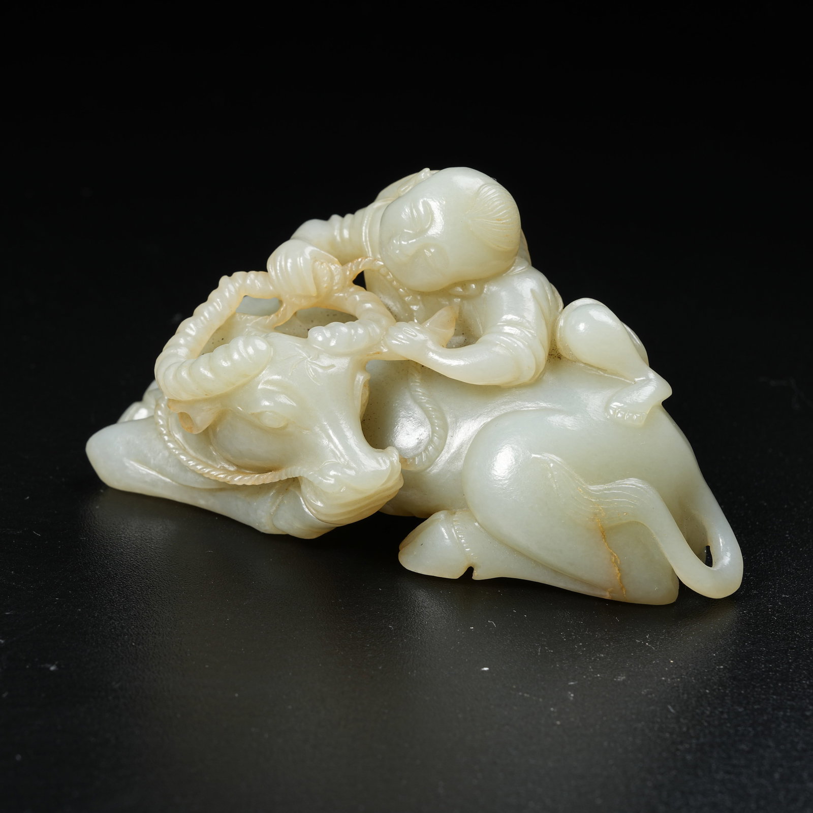 A HETIAN JADE ORNAMENT OF HERDING BOY WITH BUFFALO: Hetian Jade Ornament of Herding Boy with Buffalo