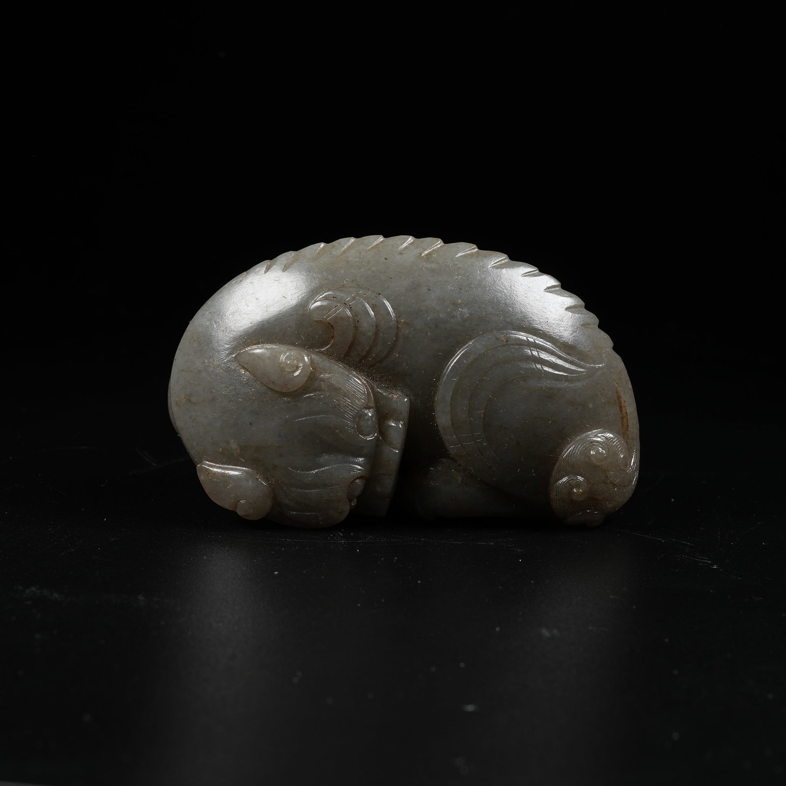 A HOTAN JADE AUSPICIOUS BEAST ORNAMENT (1 of 6)
