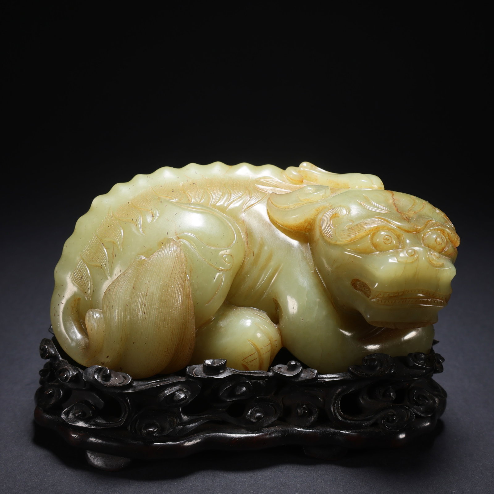 A HETIAN HUANGYU WOODEN-BASE RIGHT-TURNING BEAST (1 of 9)