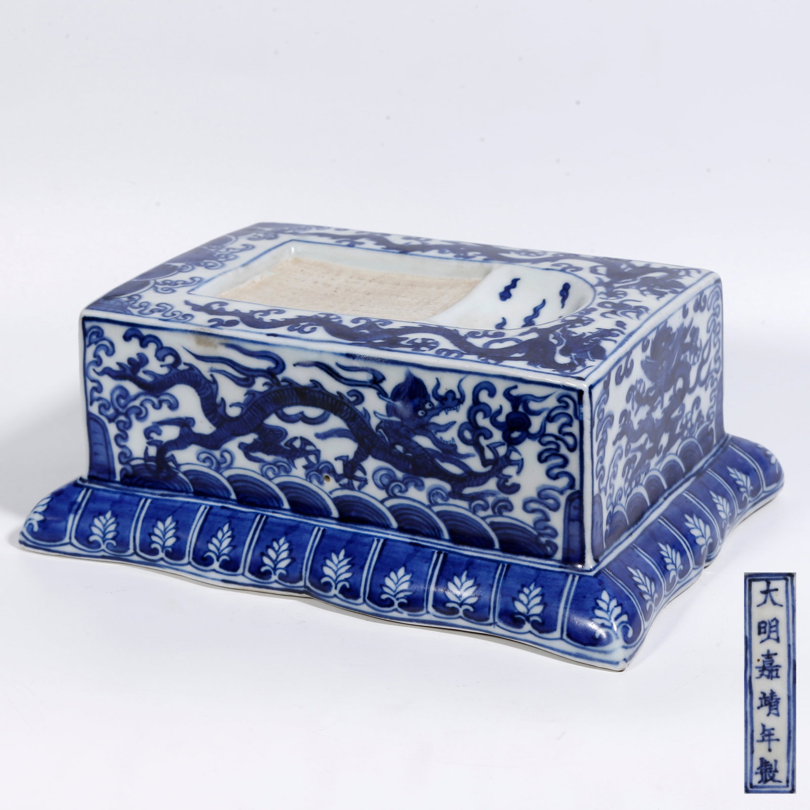 A BLUE-AND-WHITE INKSTONE WITH TWO DRAGONS PLAYING WITH A PEARL: Blue-and-White Inkstone with Two Dragons Playing with a Pearl