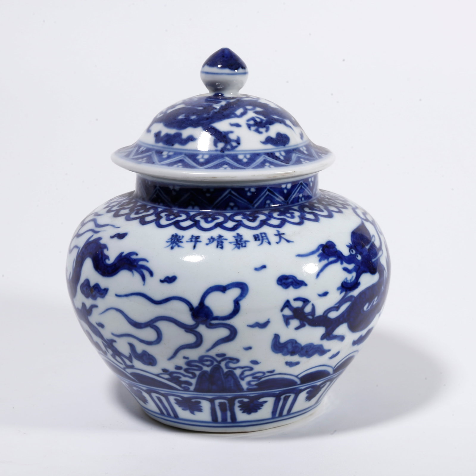 A BLUE AND WHITE LIDDED JAR WITH DRAGON PATTERN: Blue and White Lidded Jar with Dragon Pattern