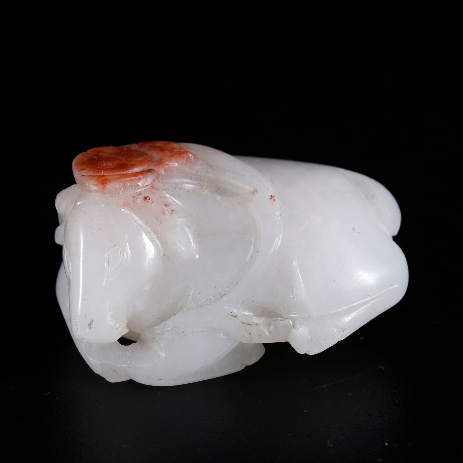 A HETIAN JADE CARVED SHEEP-SHAPED ORNAMENT (1 of 9)