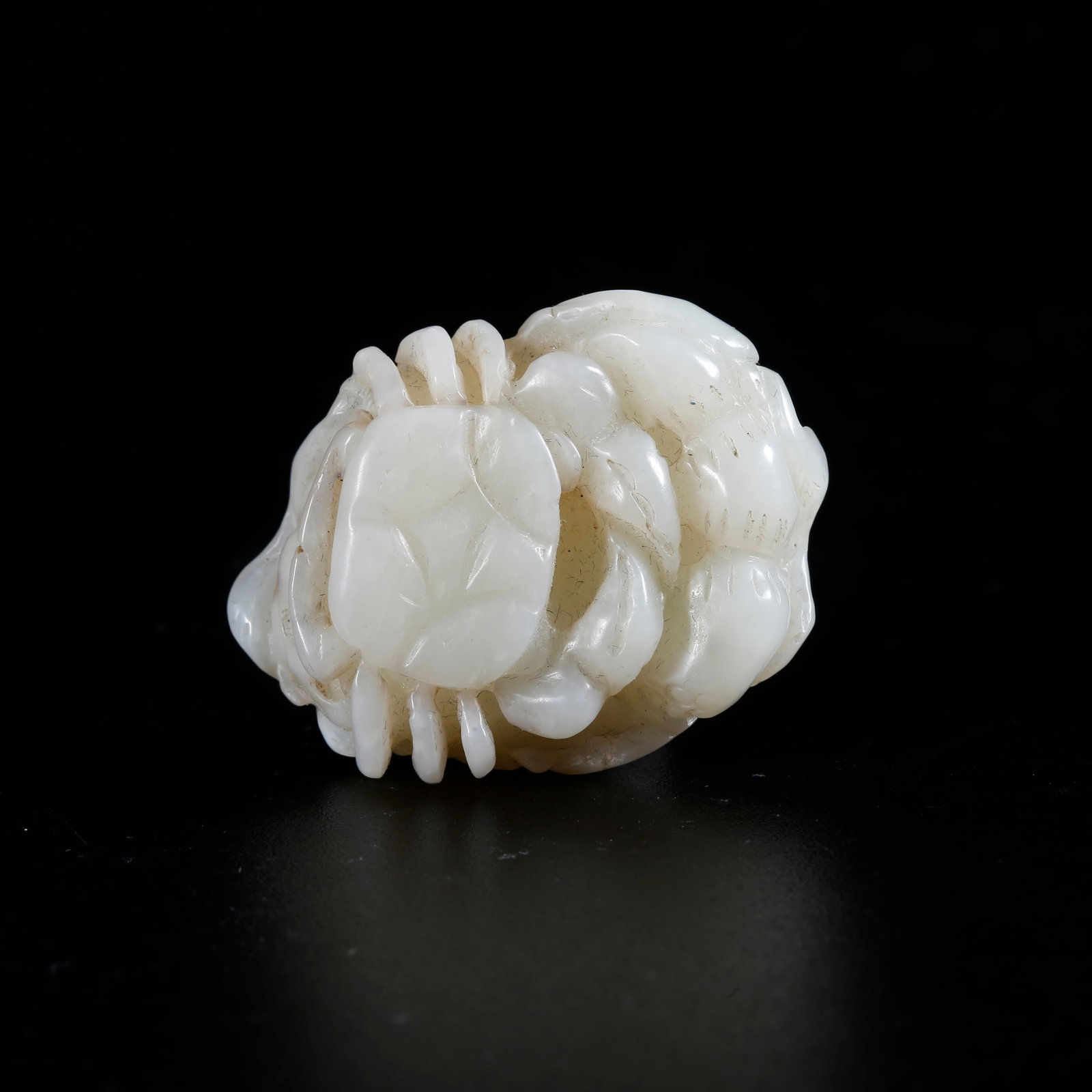 A HETIAN JADE CARVED CRAB-SHAPED ORNAMENT: Hetian Jade Carved Crab-shaped Ornament