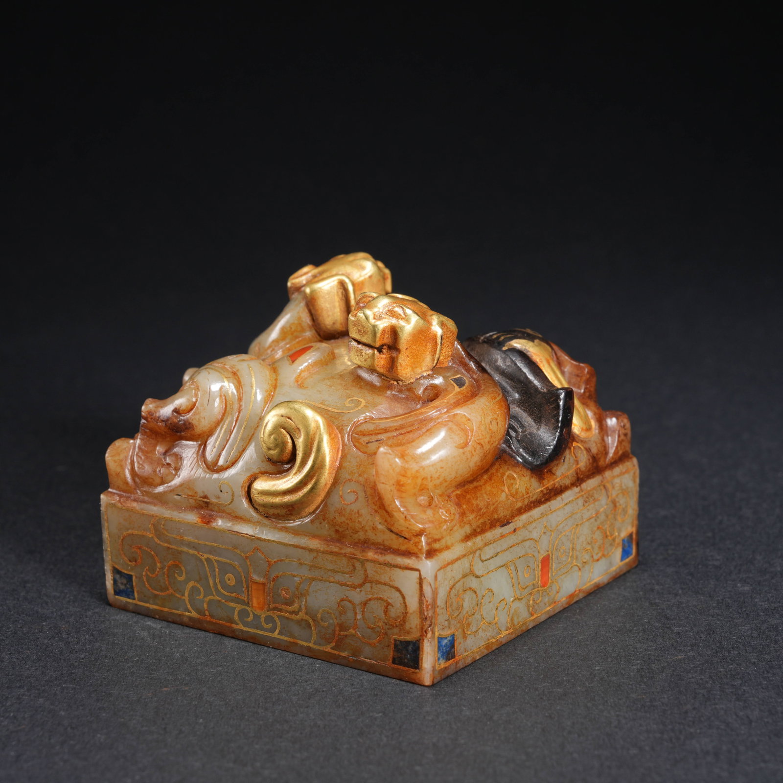 A HETIAN JADE GILT-INLAID SEAL WITH BEAST-FACE AND DRAGON FINIAL: Hetian Jade Gilt-Inlaid Seal with Beast-Face and Dragon Finial