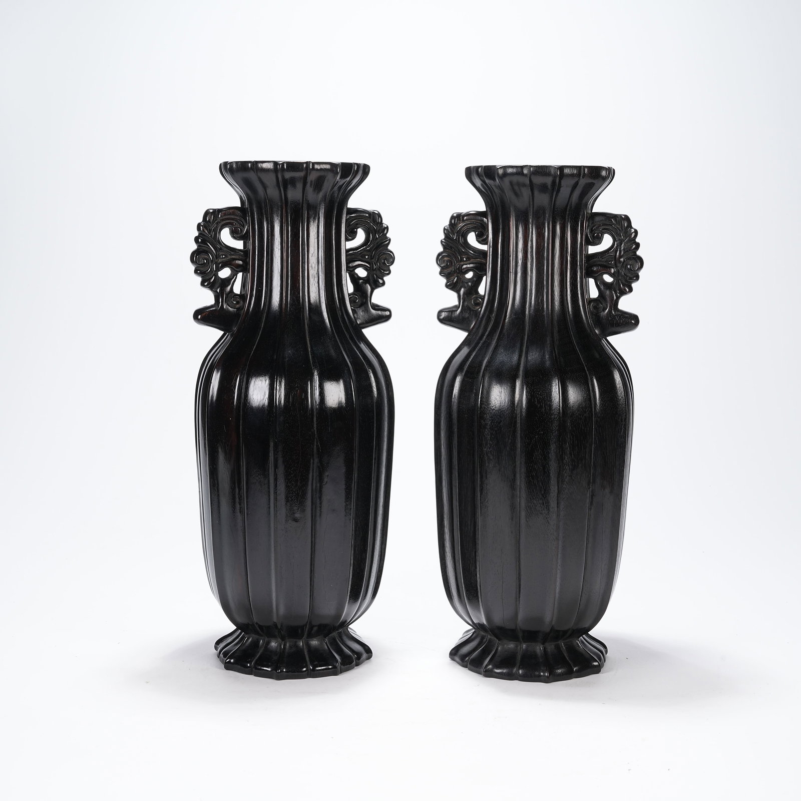 A GROUP OF ZITAN WOOD VASES WITH PHOENIX EARS: Group of Zitan Wood Vases with Phoenix Ears