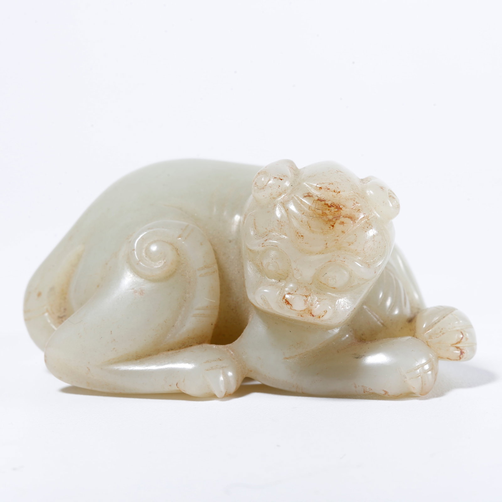 A HOTAN JADE CARVED TIGER ORNAMENT: Hotan Jade Carved Tiger Ornament