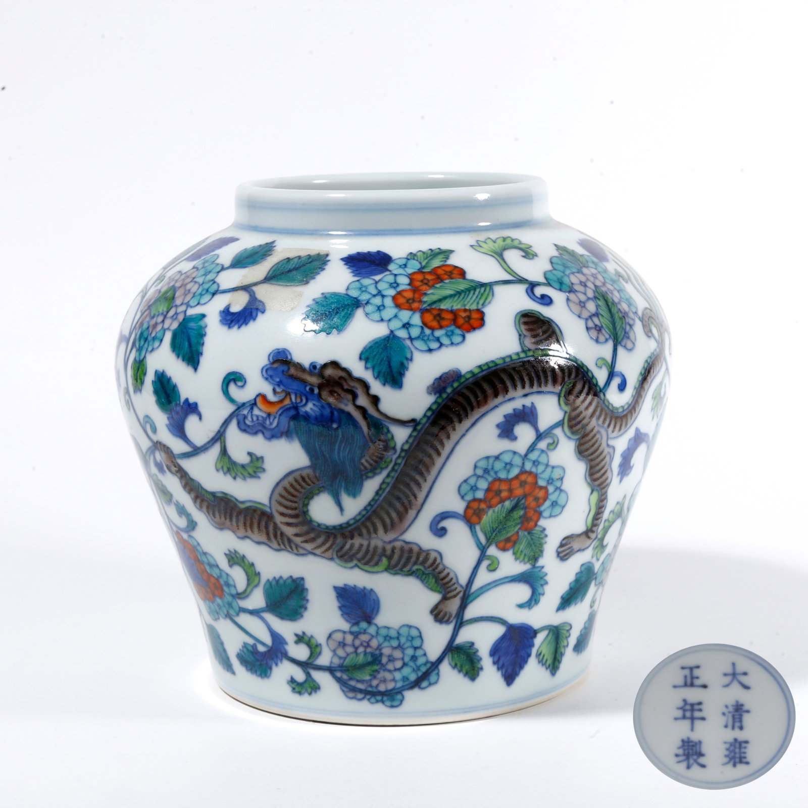 A DOUCAI JAR WITH DRAGON AMIDST FLORAL PATTERN: Doucai Jar with Dragon Amidst Floral Pattern