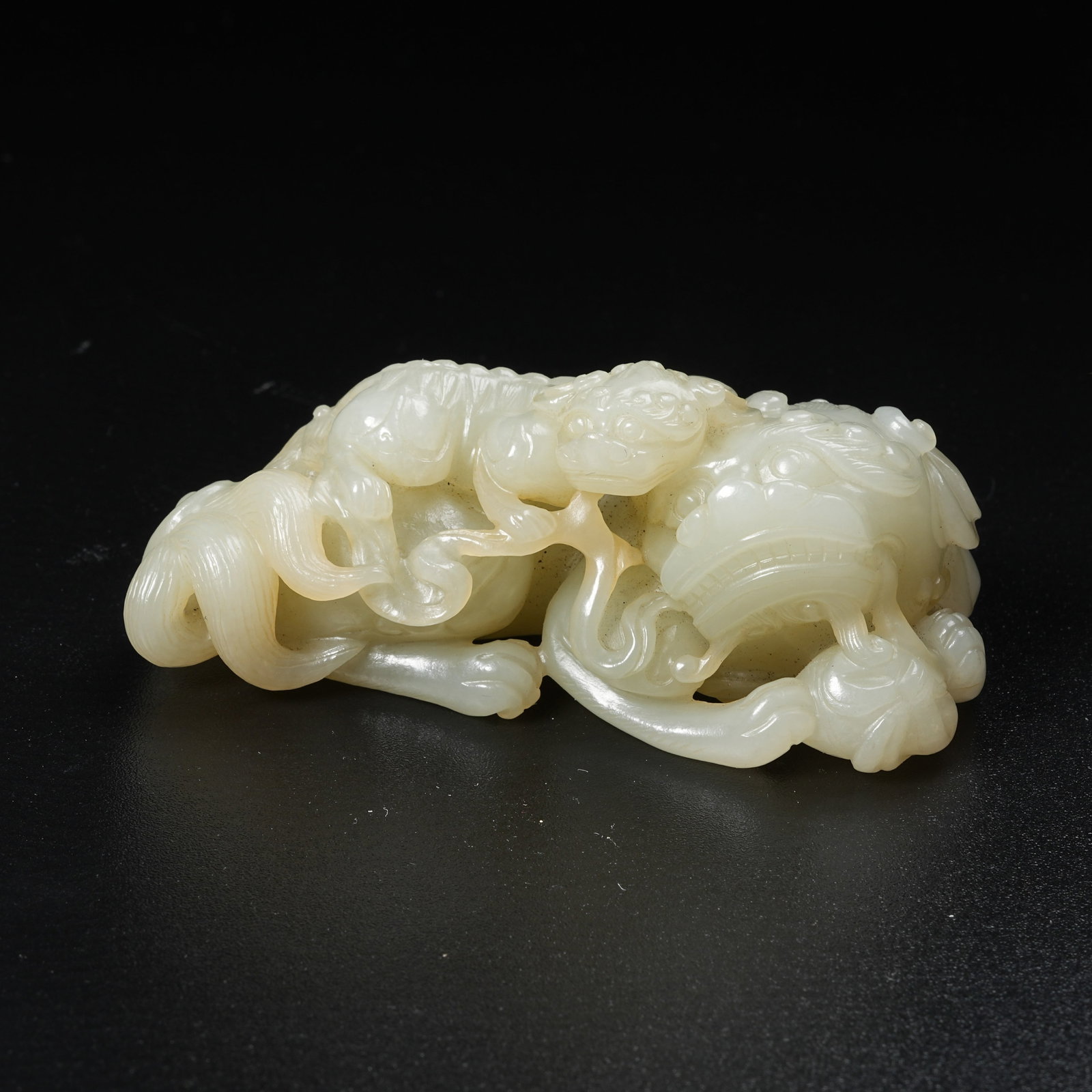 A HETIAN JADE ORNAMENT OF LARGE LION AND YOUNG LION: Hetian Jade Ornament of Large Lion and Young Lion