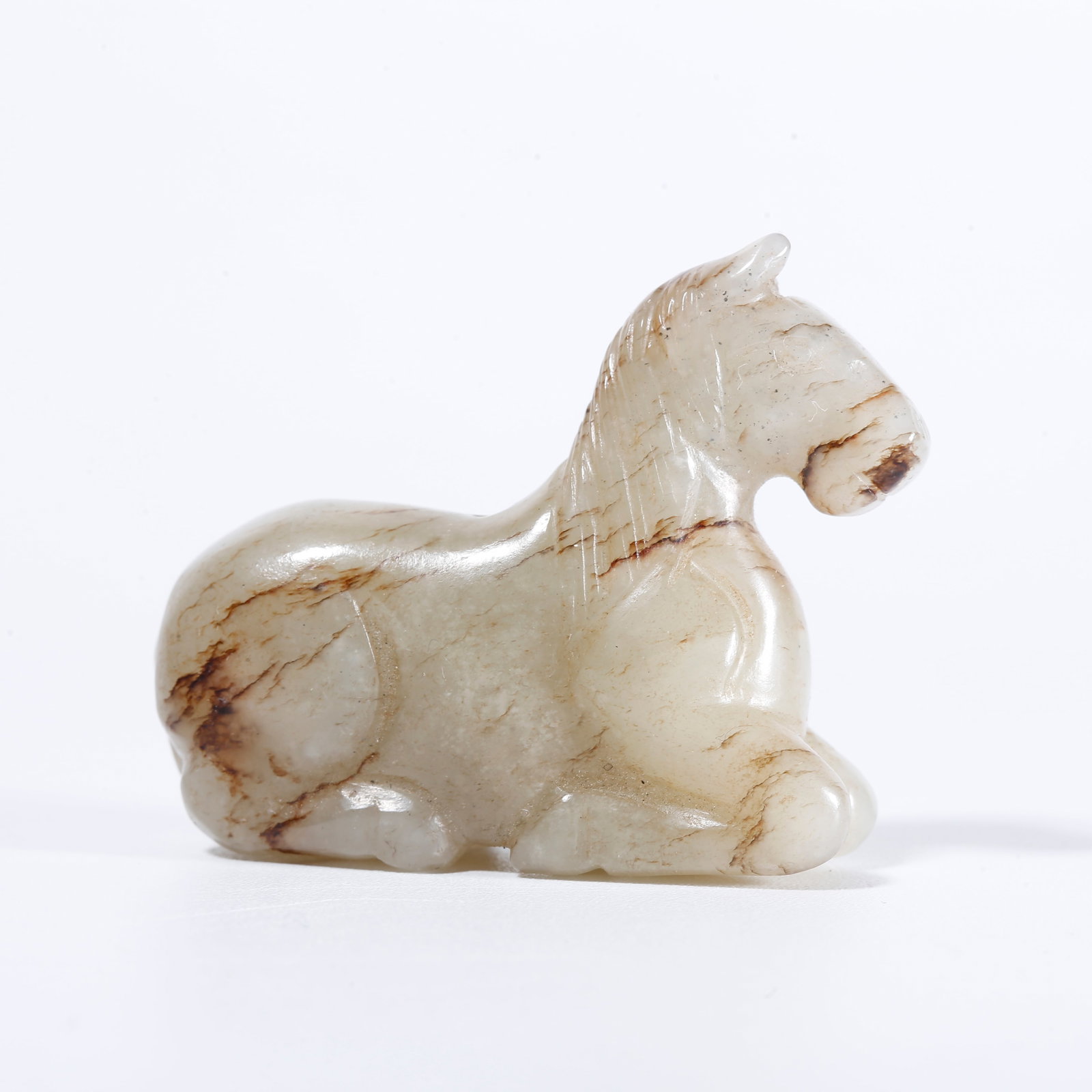 A HOTAN JADE CARVED STEED ORNAMENT: Hotan Jade Carved Steed Ornament
