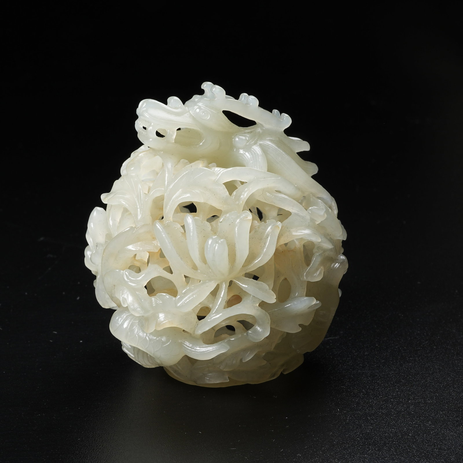 A HETIAN JADE SPHERICAL CENSER WITH DRAGON PIERCING FLORAL PATTERN: Hetian Jade Spherical Censer with Dragon Piercing Floral Pattern