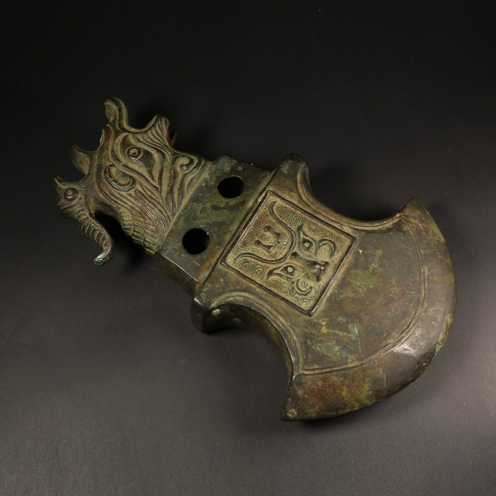 A BRONZE AXE WITH ANIMAL-FACE MOTIF (1 of 10)
