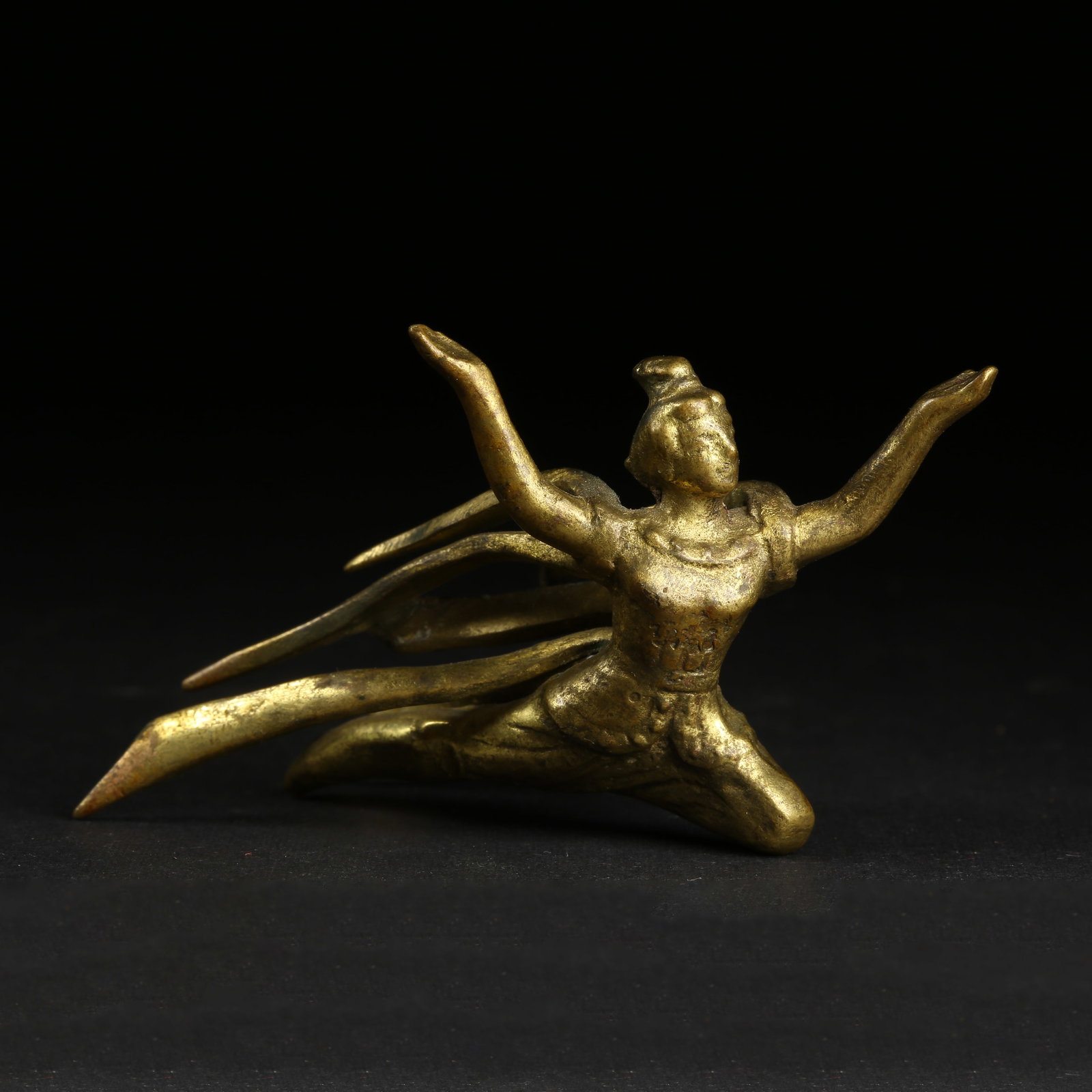 A GILT-BRONZE FLYING APSARA (1 of 8)