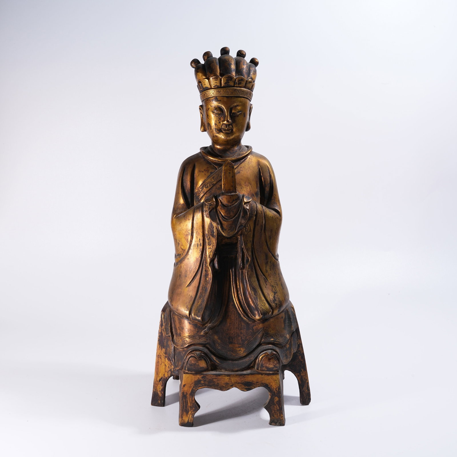 A BRONZE SEATED FIGURE: Bronze Seated Figure