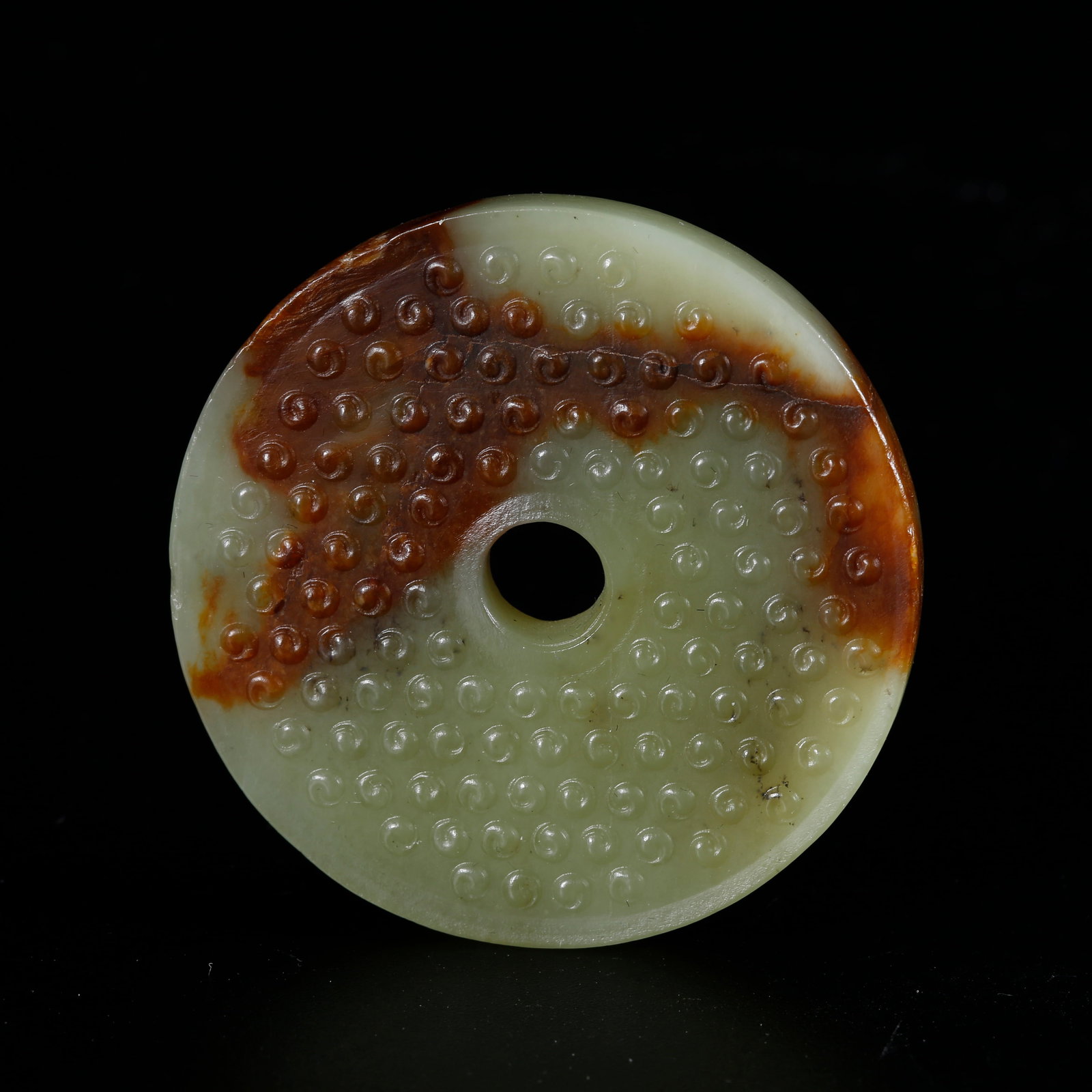 A HETIAN YELLOW JADE CARVED BI DISC WITH NAIL PATTERN: Hetian Yellow Jade Carved Bi Disc with Nail Pattern