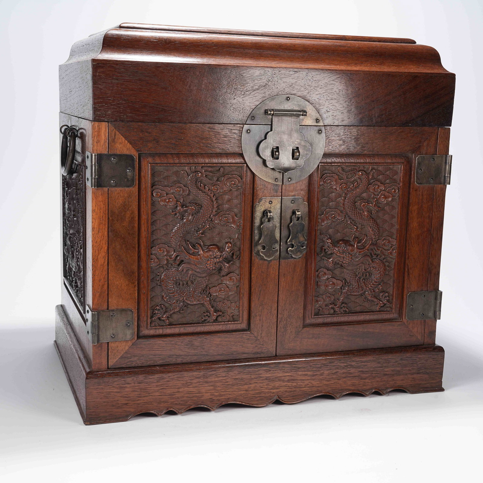 A HUANGHUALI WOOD TREASURE CHEST WITH CLOUD AND DRAGON PATTERN: Huanghuali Wood Treasure Chest with Cloud and Dragon Pattern