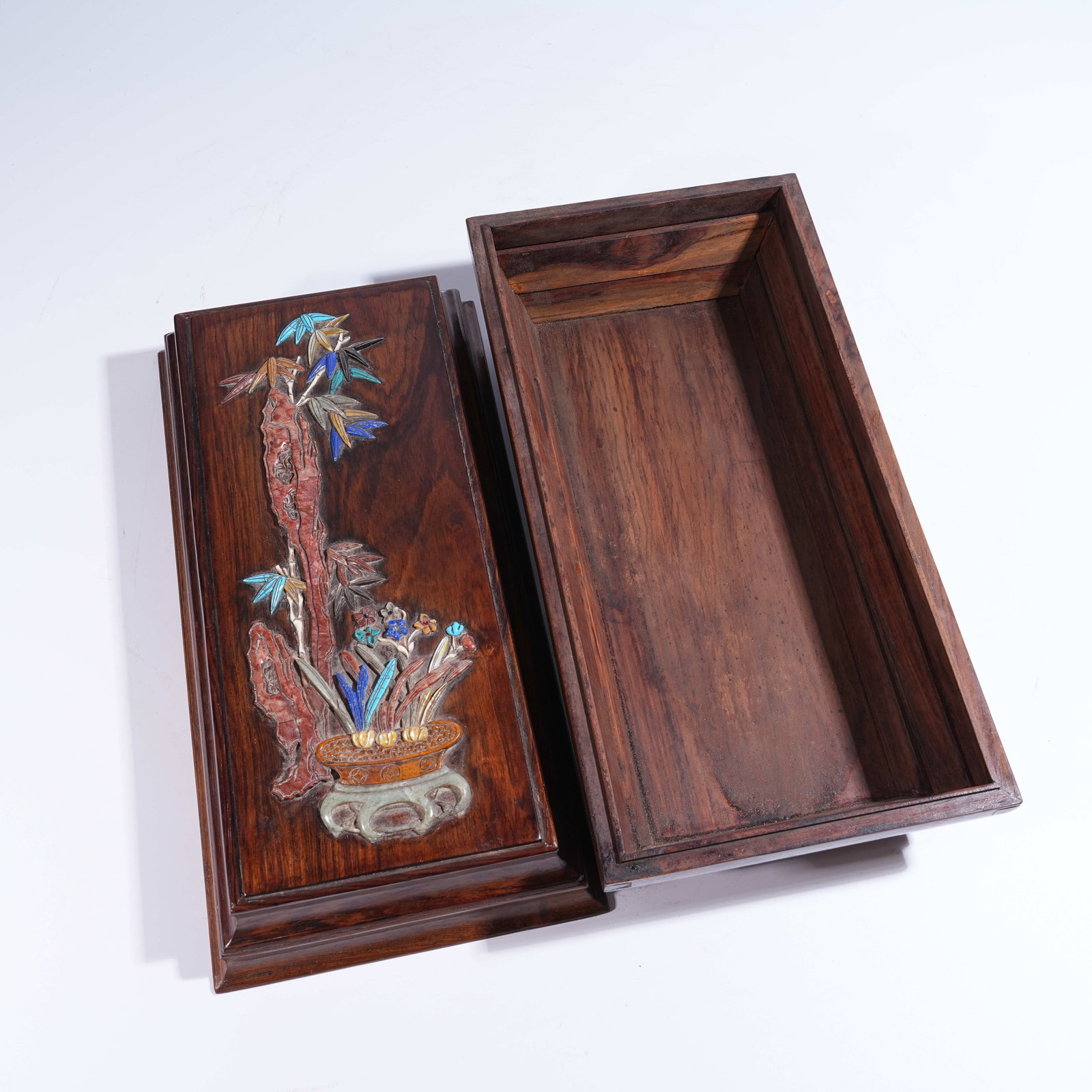 A HUANGHUALI COVERED BOX INLAID WITH "HUNDRED TREASURES" DEPICTING SCHOLAR'S ROCK AND FLORAL MOTIFS: Huanghuali Covered Box Inlaid with "Hundred Treasures" Depicting Scholar's Rock and Floral Motifs