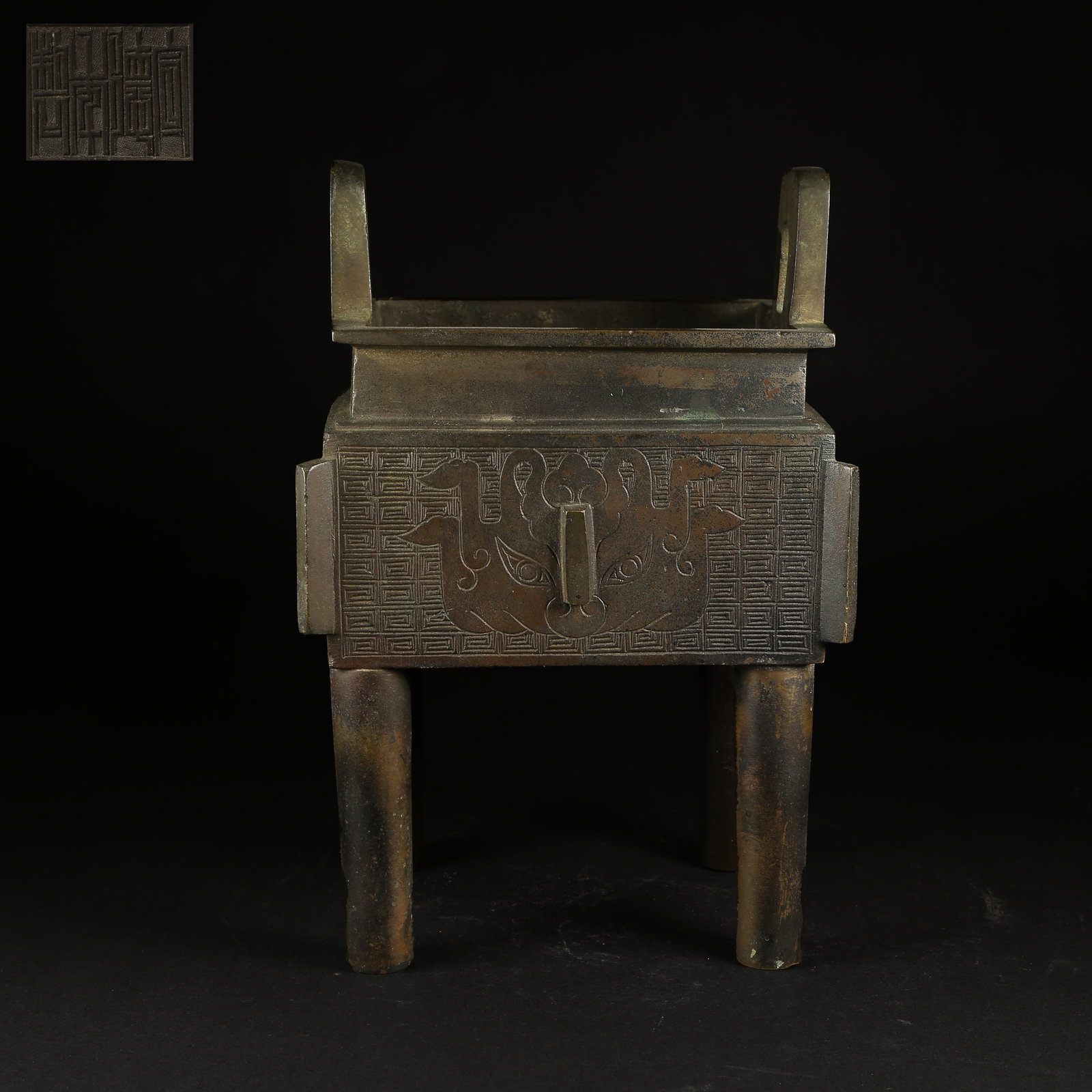 A BRONZE AXE-MOTIF TRIPOD DING CENSER (1 of 9)