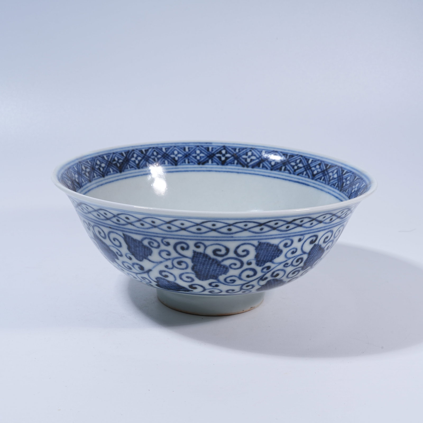 A BLUE-AND-WHITE BOWL WITH FLORAL MOTIFS: Blue-and-White Bowl with Floral Motifs