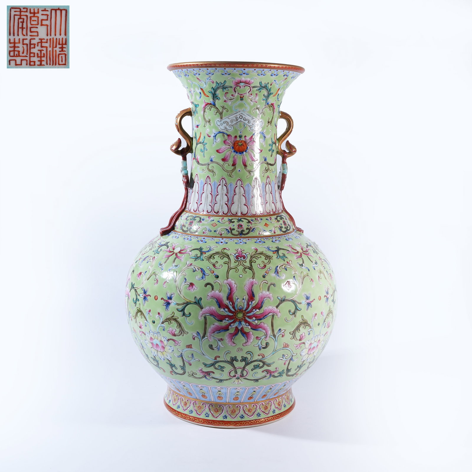 A TURQUOISE-GROUND FAMILLE ROSE ZUN VASE WITH INTERLACED FLORAL SCROLLS AND RUYI SCEPTER HANDLES: Turquoise-Ground Famille Rose Zun Vase with Interlaced Floral Scrolls and Ruyi Scepter Handles