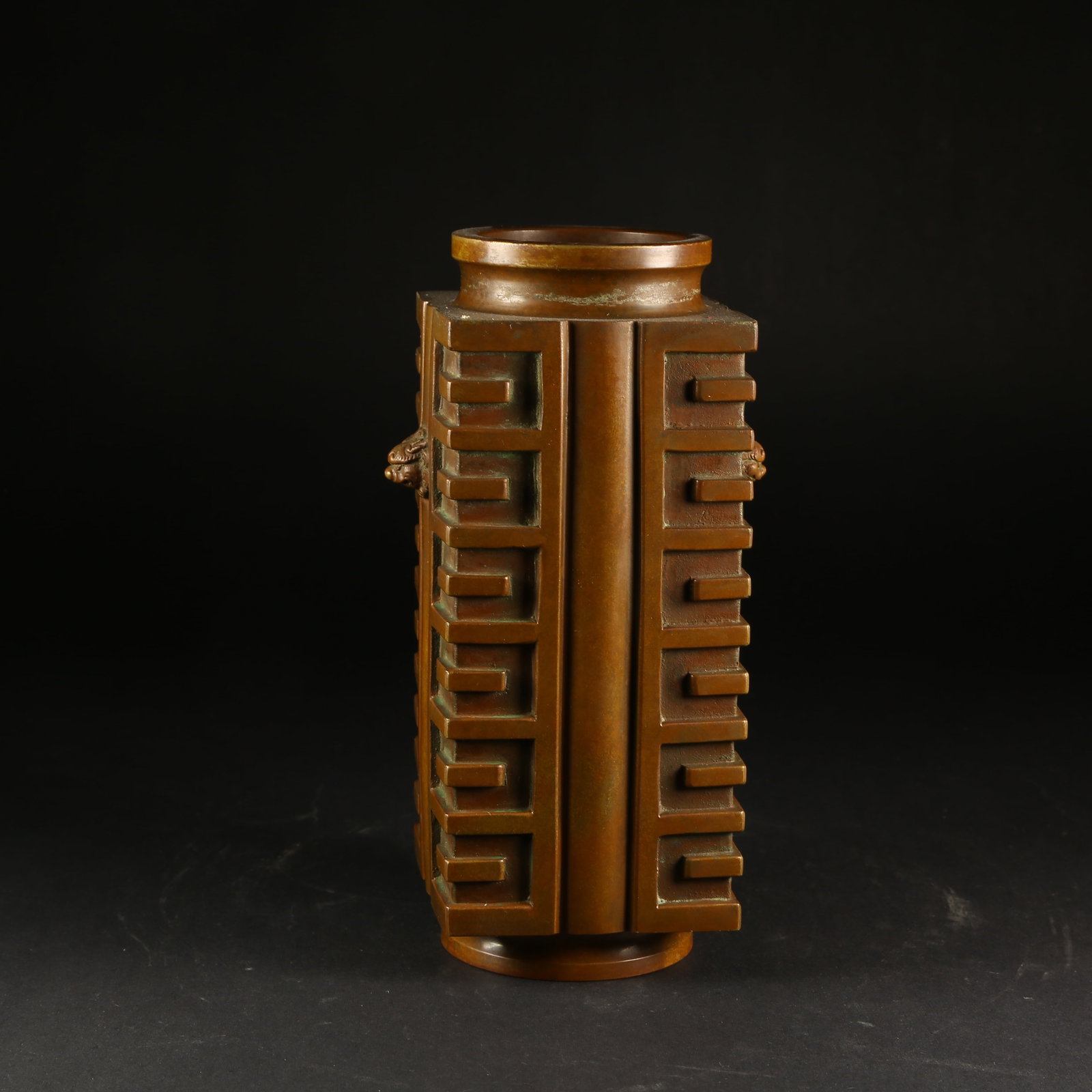 A BRONZE VASE WITH BEAST-HEAD HANDLES: Bronze Vase with Beast-Head Handles