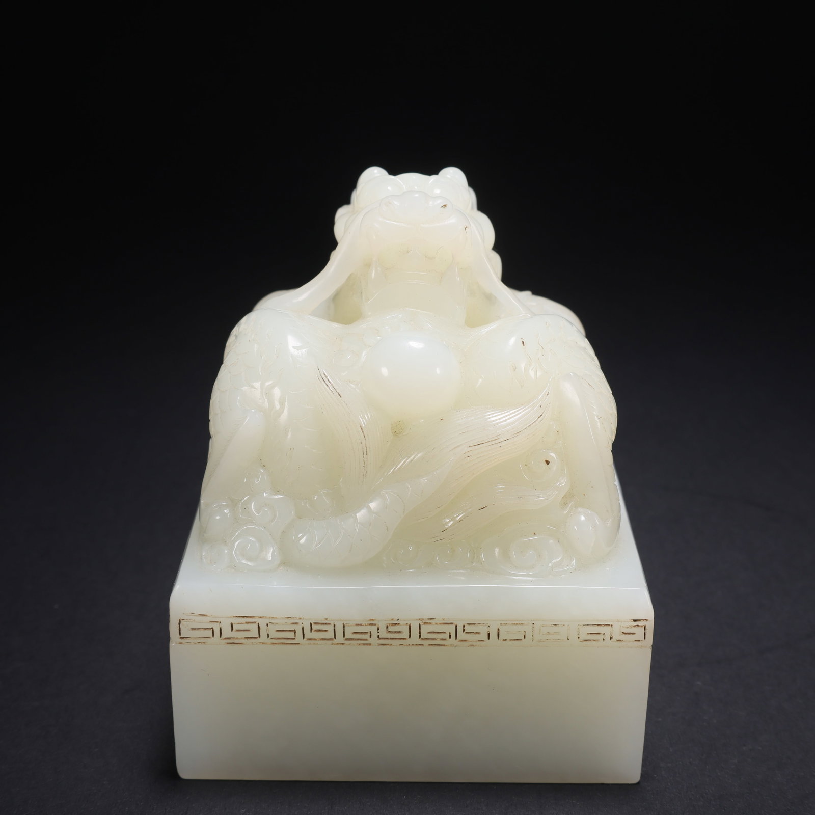 A HETIAN JADE SQUARE SEAL WITH DRAGON-PLAYING-PEARL KNOB: Hetian Jade Square Seal with Dragon-Playing-Pearl Knob