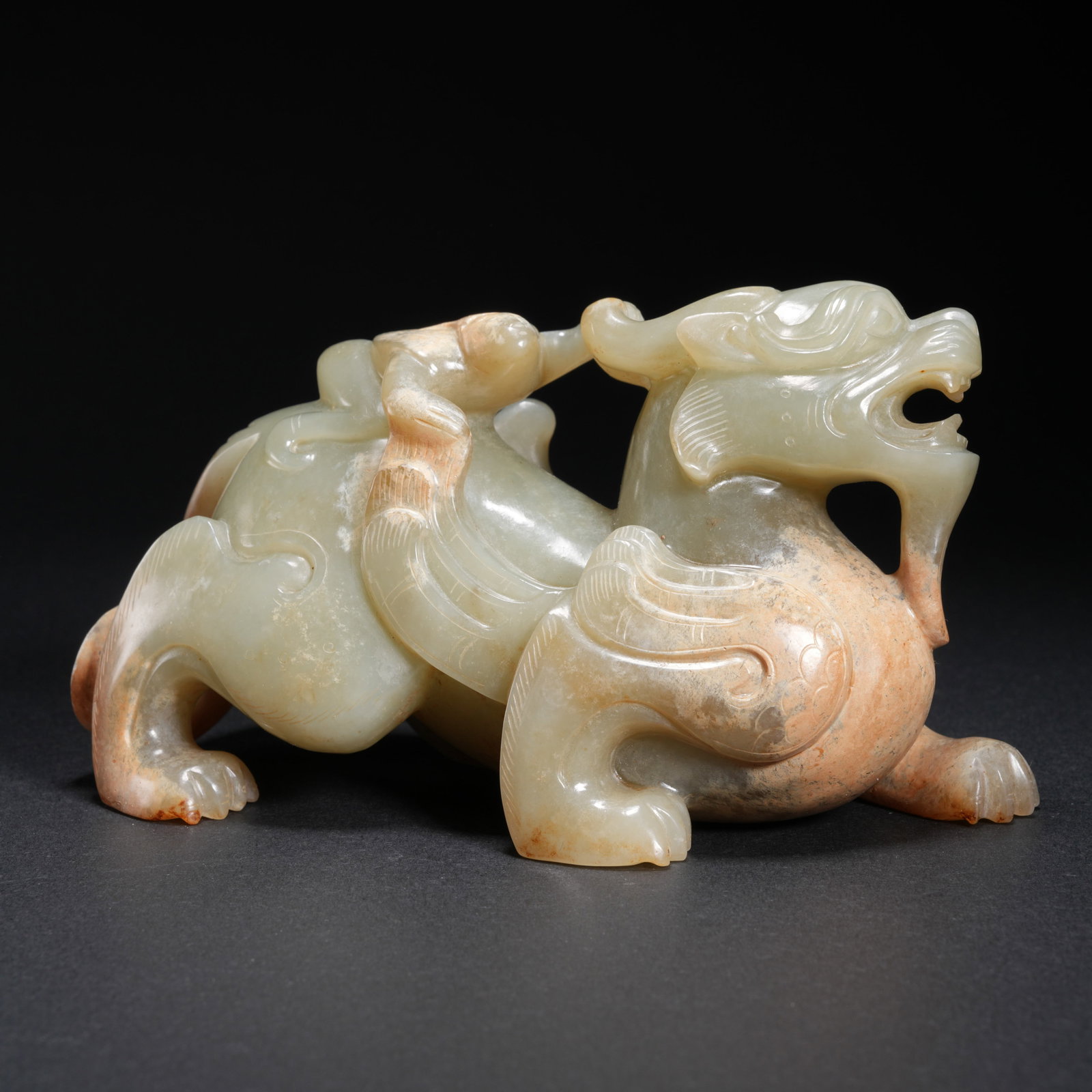 A HETIAN JADE TIGER-SHAPED ORNAMENT: Hetian Jade Tiger-Shaped Ornament
