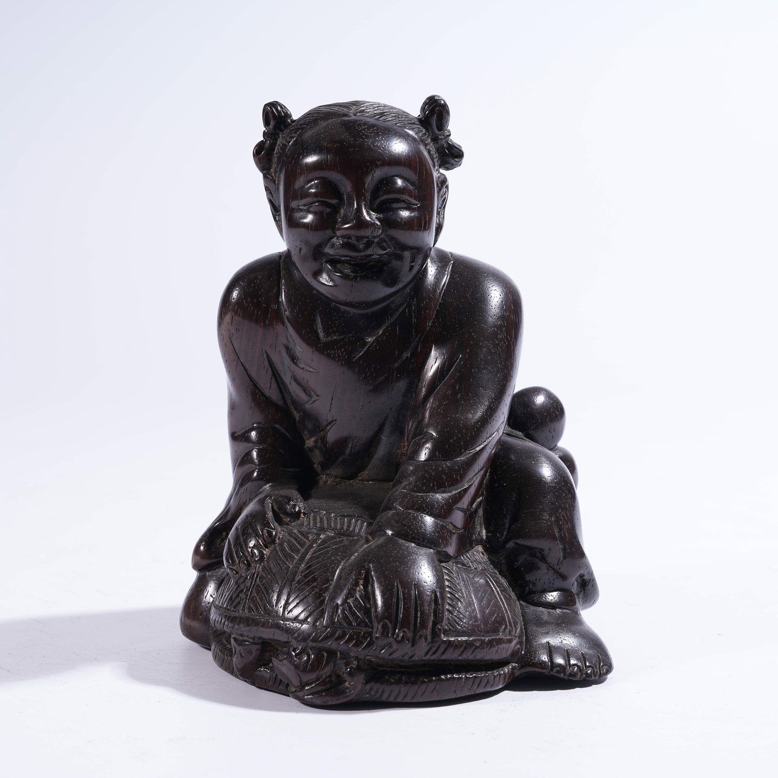 A ZITAN FIGURINE OF A BOY: Zitan Figurine of a Boy