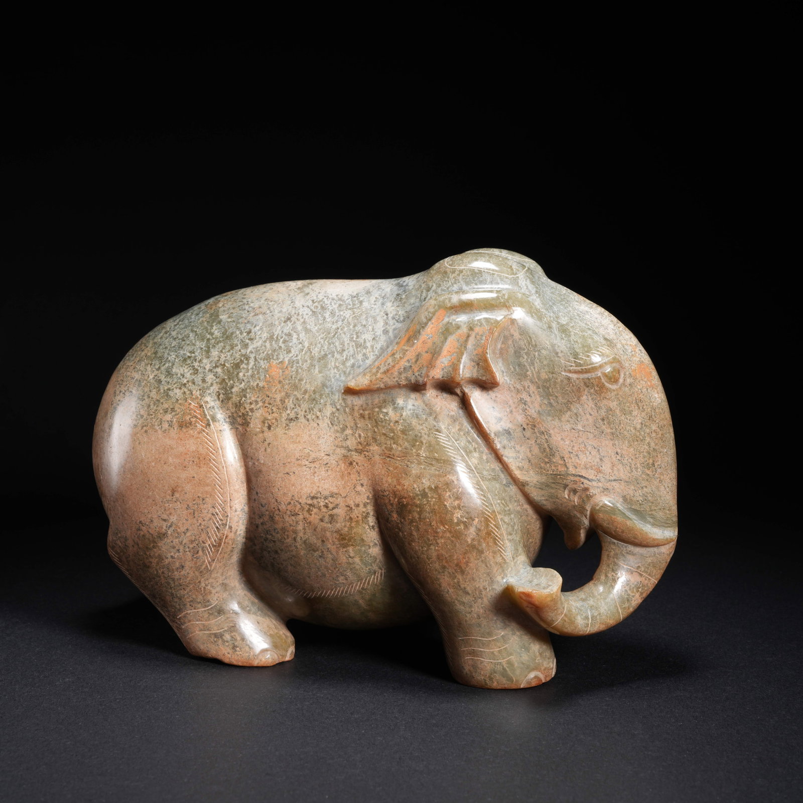 A HETIAN JADE "PEACE AND PROSPERITY" ELEPHANT-SHAPED ORNAMENT (1 of 10)